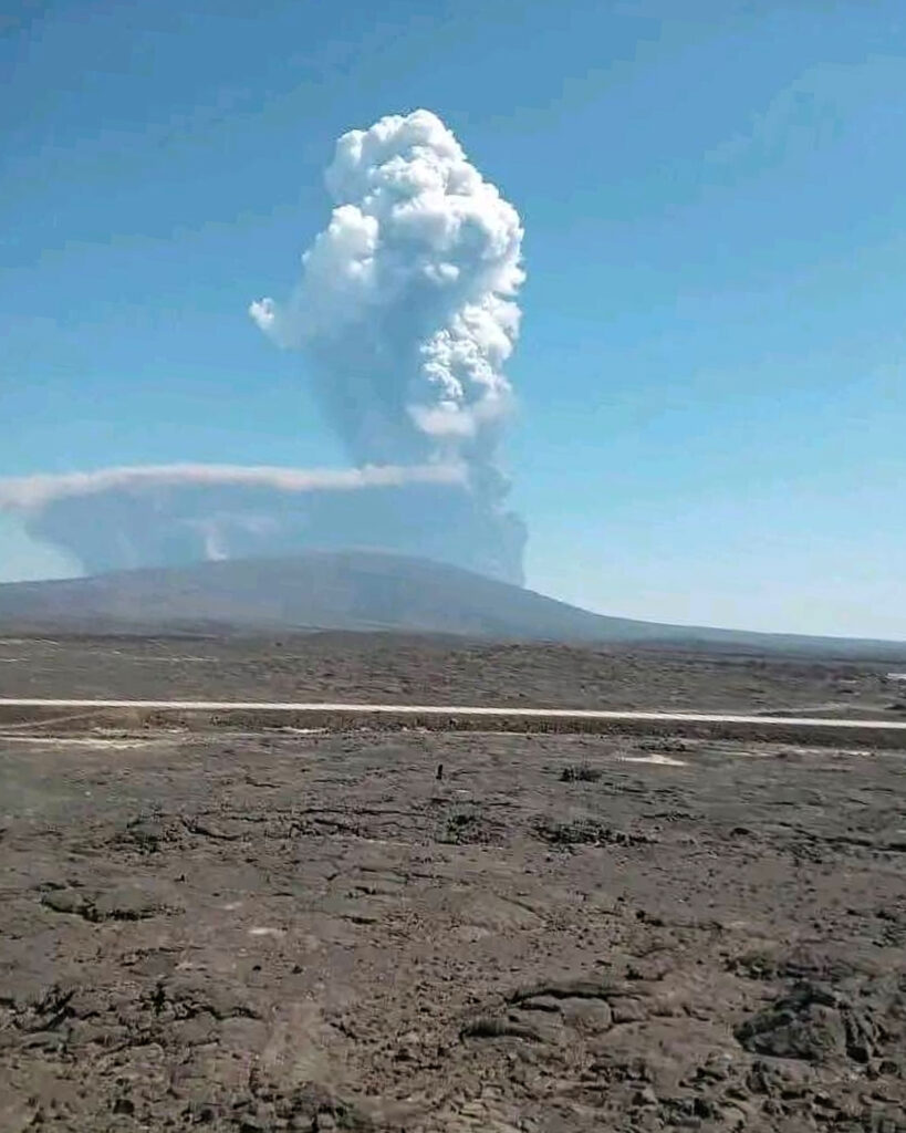 In this photo released by the Afar Government Communication Bureau, ash billows from the first time eruption of the Hayli Gubbi Volcano in Ethiopia's Afar region Sunday, Nov. 23, 2025. (Afar Government Communication Bureau via AP)