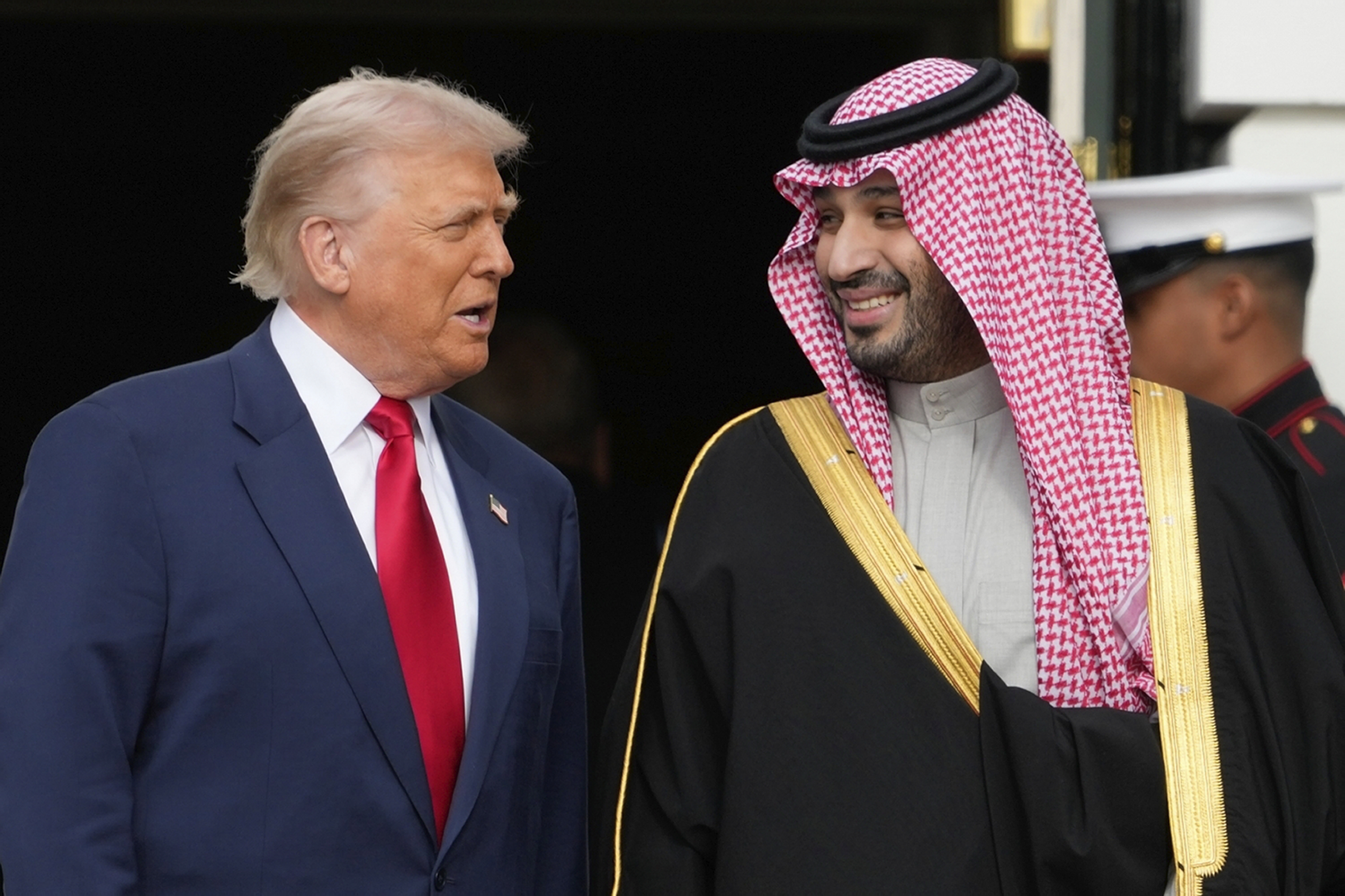President Donald Trump welcomes Saudi Arabia's Crown Prince Mohammed bin Salman to the White House, Tuesday, Nov. 18, 2025, in Washington. (AP Photo/Mark Schiefelbein)