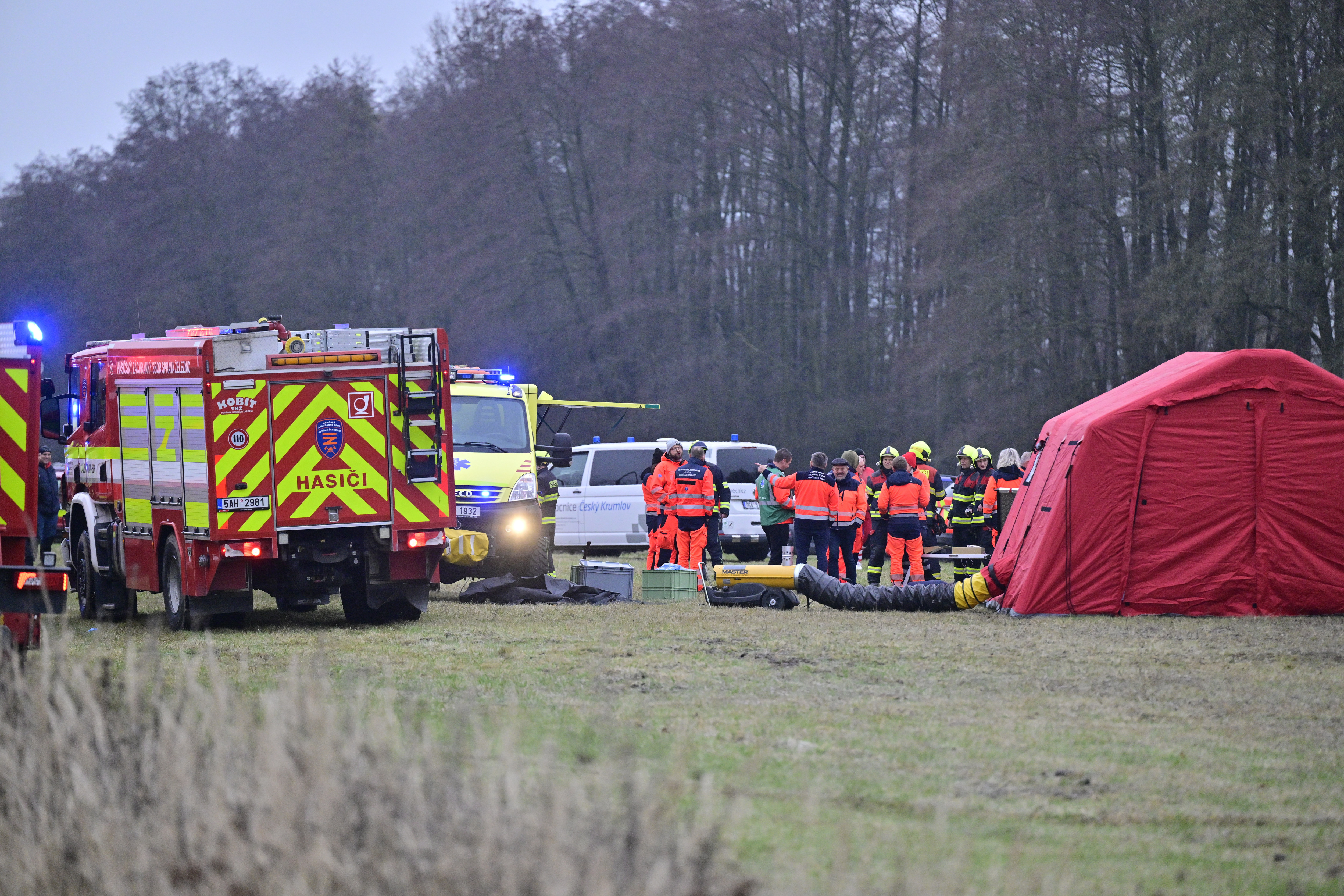 Rescuers at the scene after an express train collided with a passenger train on the line between Zliv and Dívčice in the České Budějovice region in the southern Czech Republic on Thursday, Nov.20, 2025. (Vaclav Pancer/CTK via AP)