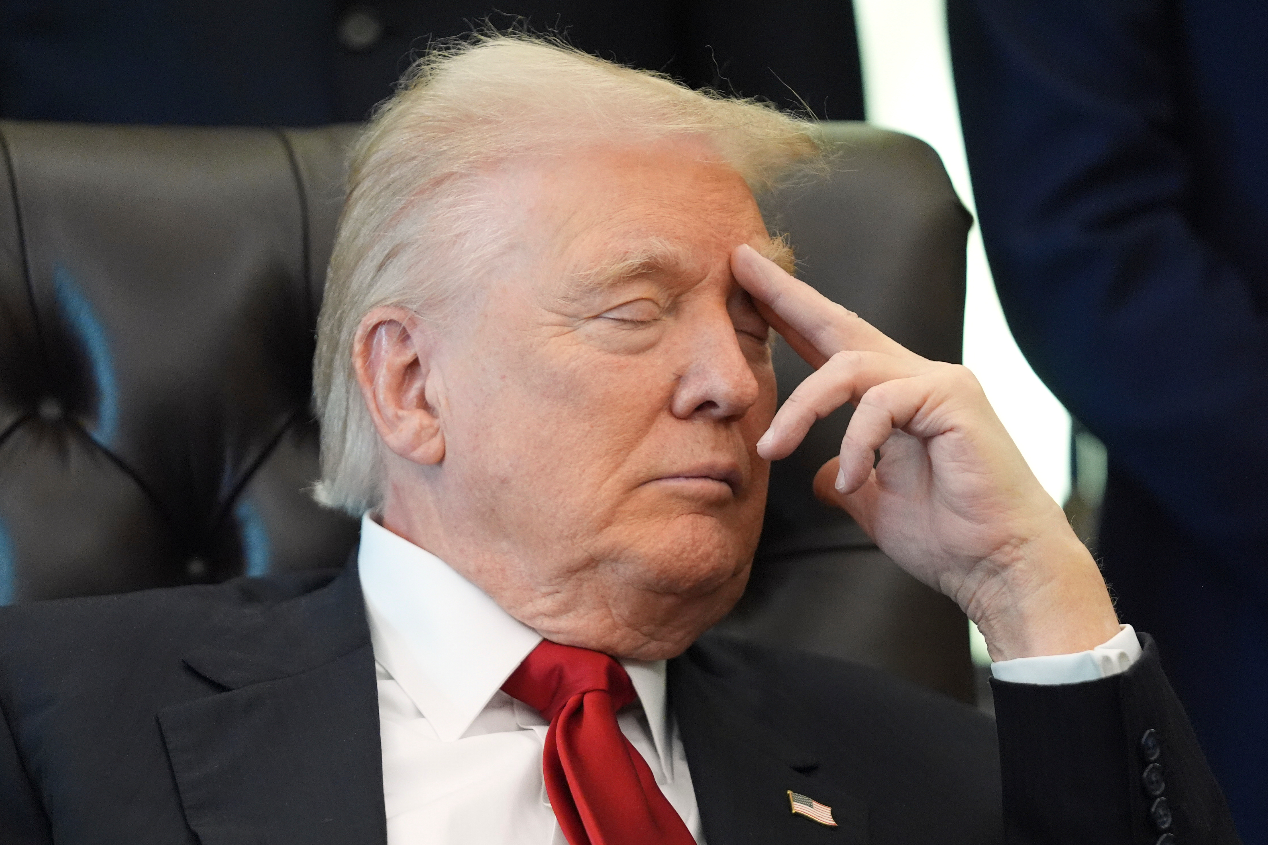 President Donald Trump listens as Health and Human Services Secretary Robert F. Kennedy Jr. speaks during an event about drug prices, Thursday, Nov. 6, 2025, in the Oval Office of the White House in Washington. (AP Photo/Evan Vucci)