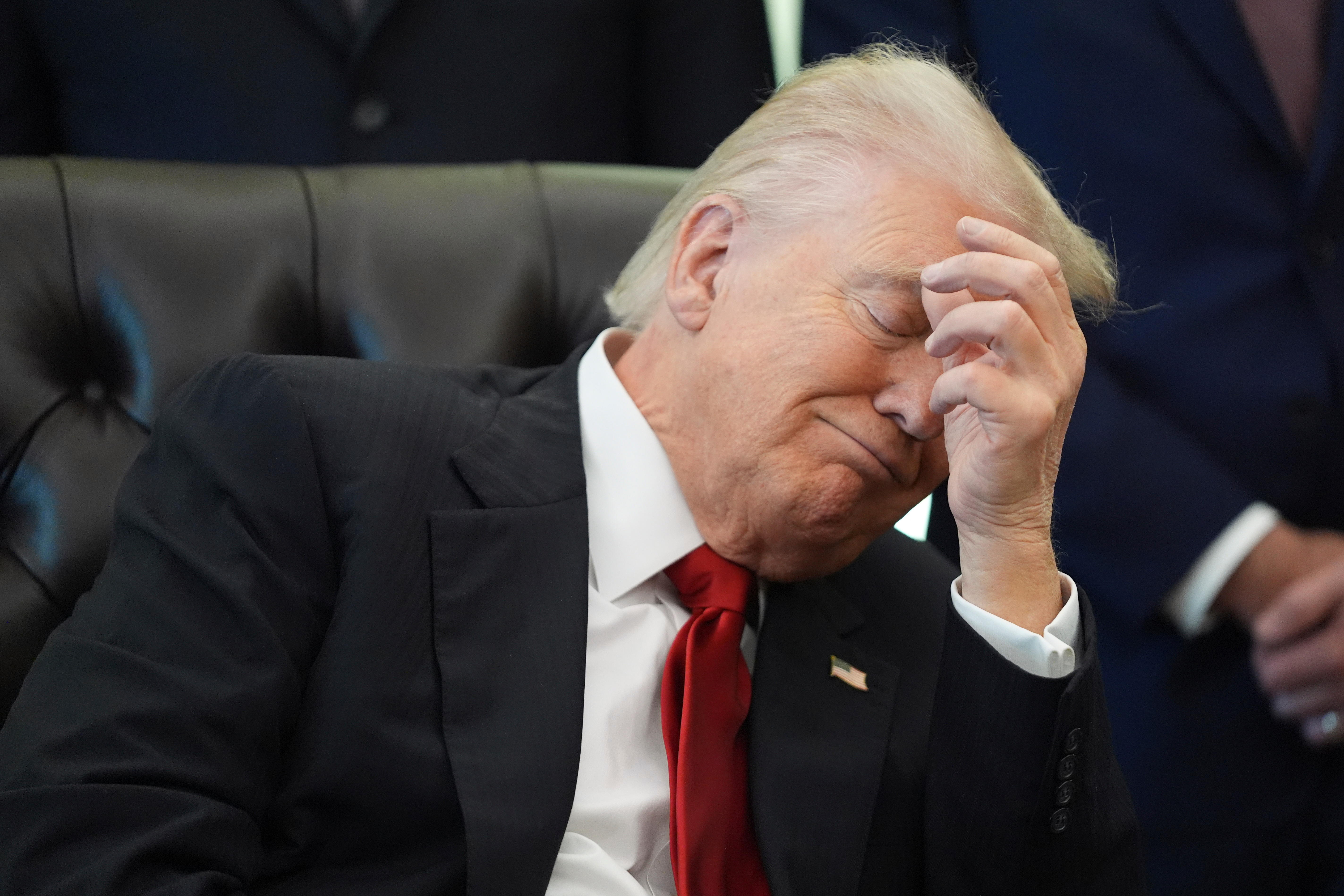 President Donald Trump listens as Health and Human Services Secretary Robert F. Kennedy Jr. speaks during an event about drug prices, Thursday, Nov. 6, 2025, in the Oval Office of the White House in Washington. (AP Photo/Evan Vucci)