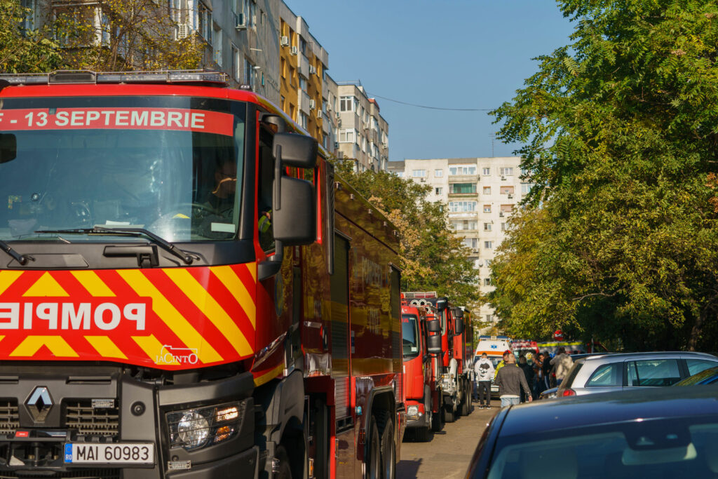 Emergency teams in front of a damaged apartment building after a powerful explosion in a residential block in Bucharest, Romania, Friday, Oct. 17, 2025. (AP Photo)
