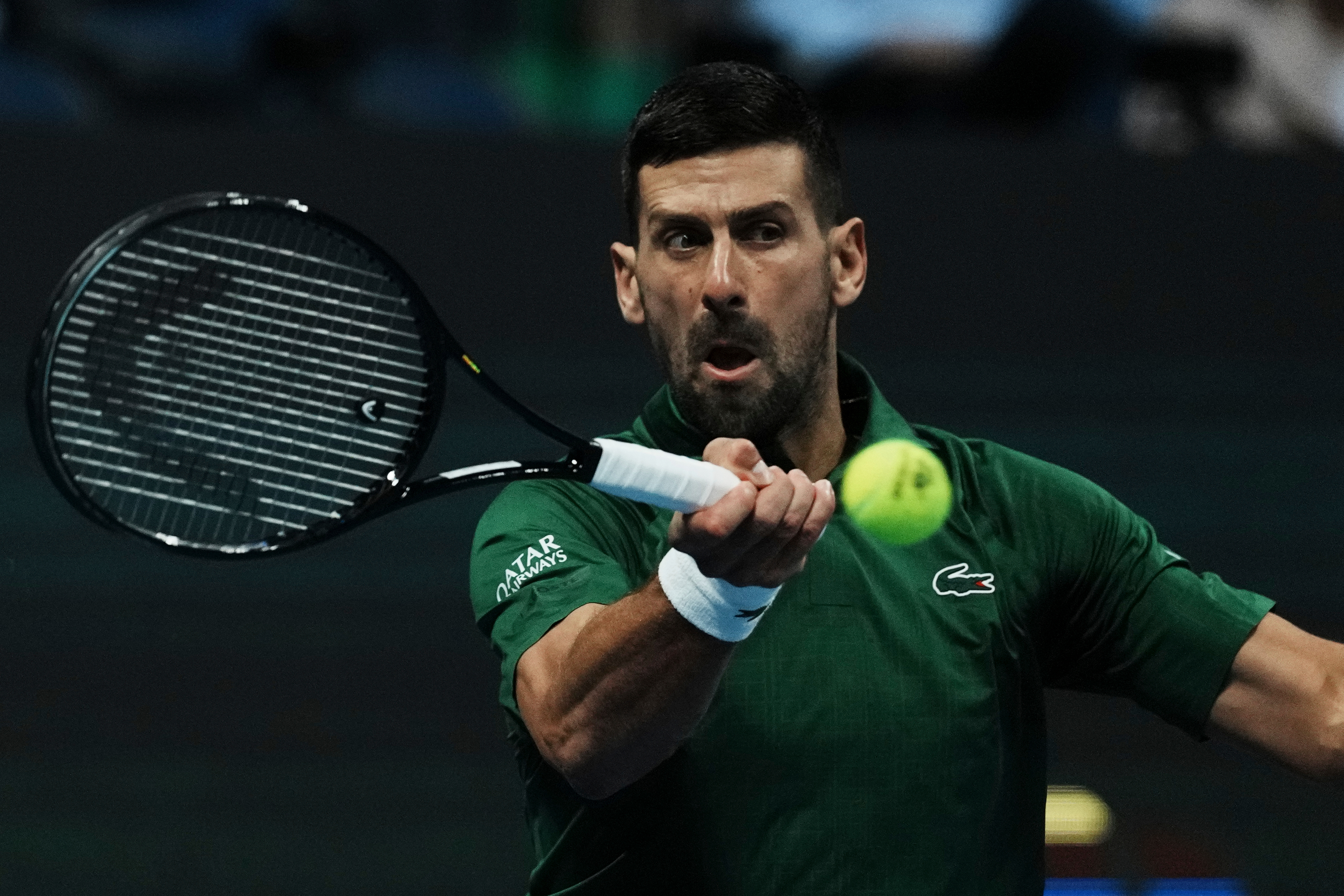 Novak Djokovic of Serbia plays a shot against Yannick Hanfmann of Germany during the ATP250 tournament semifinal tennis match, in Athens, Greece, Friday, Nov. 7, 2025. (AP Photo/Thanassis Stavrakis)