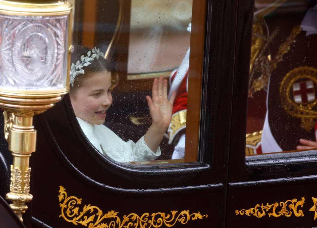 Britain's Princess Charlotte waves  following the coronation ceremony of Britain's King Charles and Queen Camilla, along The Mall in London, Britain May 6, 2023. REUTERS/Paul Childs/Pool