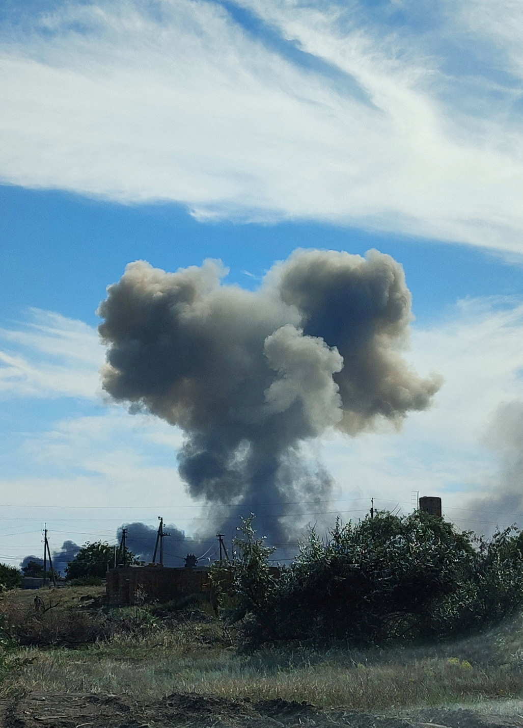 Smoke rises after explosions were heard from the direction of a Russian military airbase near Novofedorivka, Crimea August 9, 2022. REUTERS/Stringer