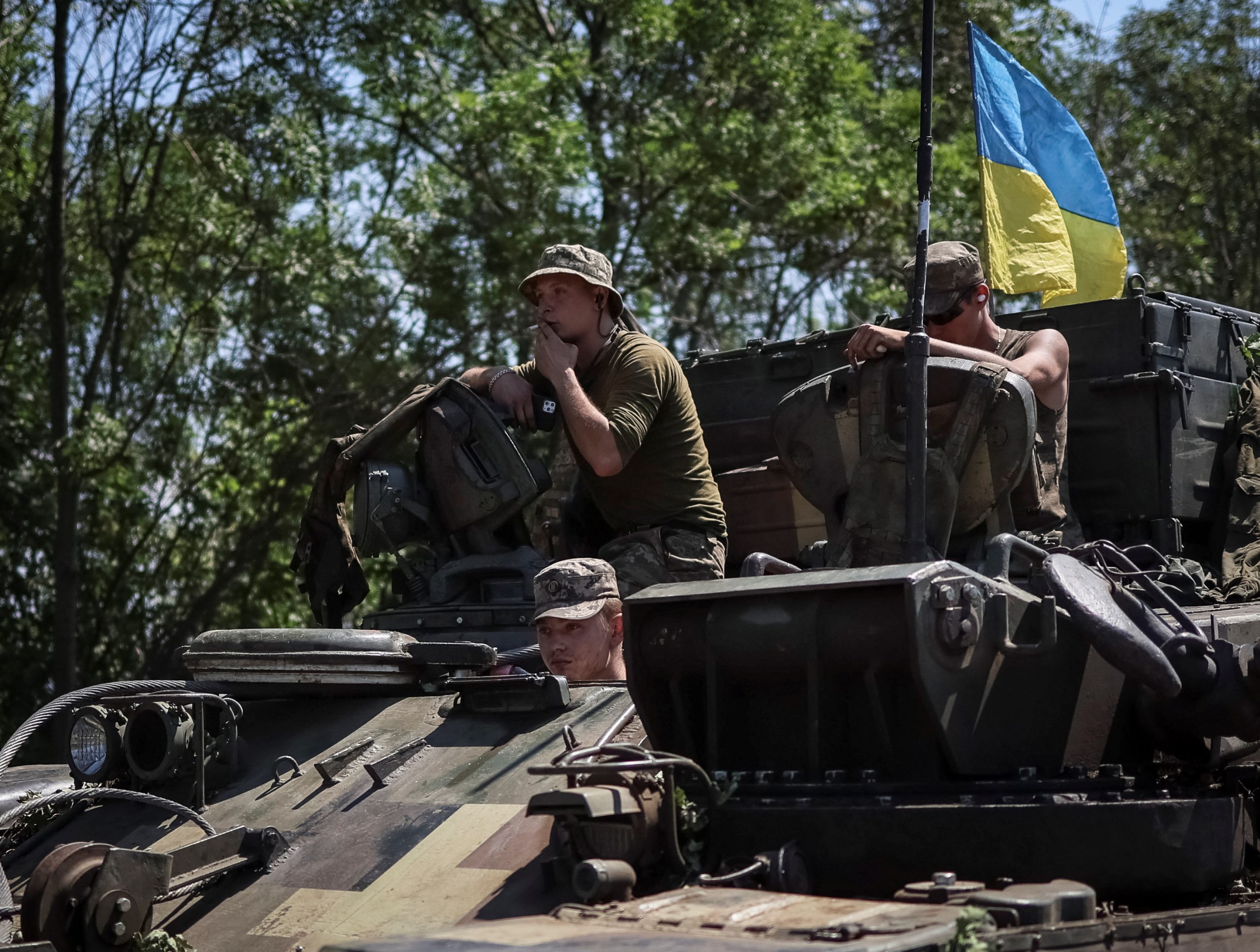 Ukrainian servicemen ride a military vehicle not far from front line, amid Russia's attack on Ukraine, in the Donbas region, Ukraine July 17, 2022. REUTERS/Gleb Garanich