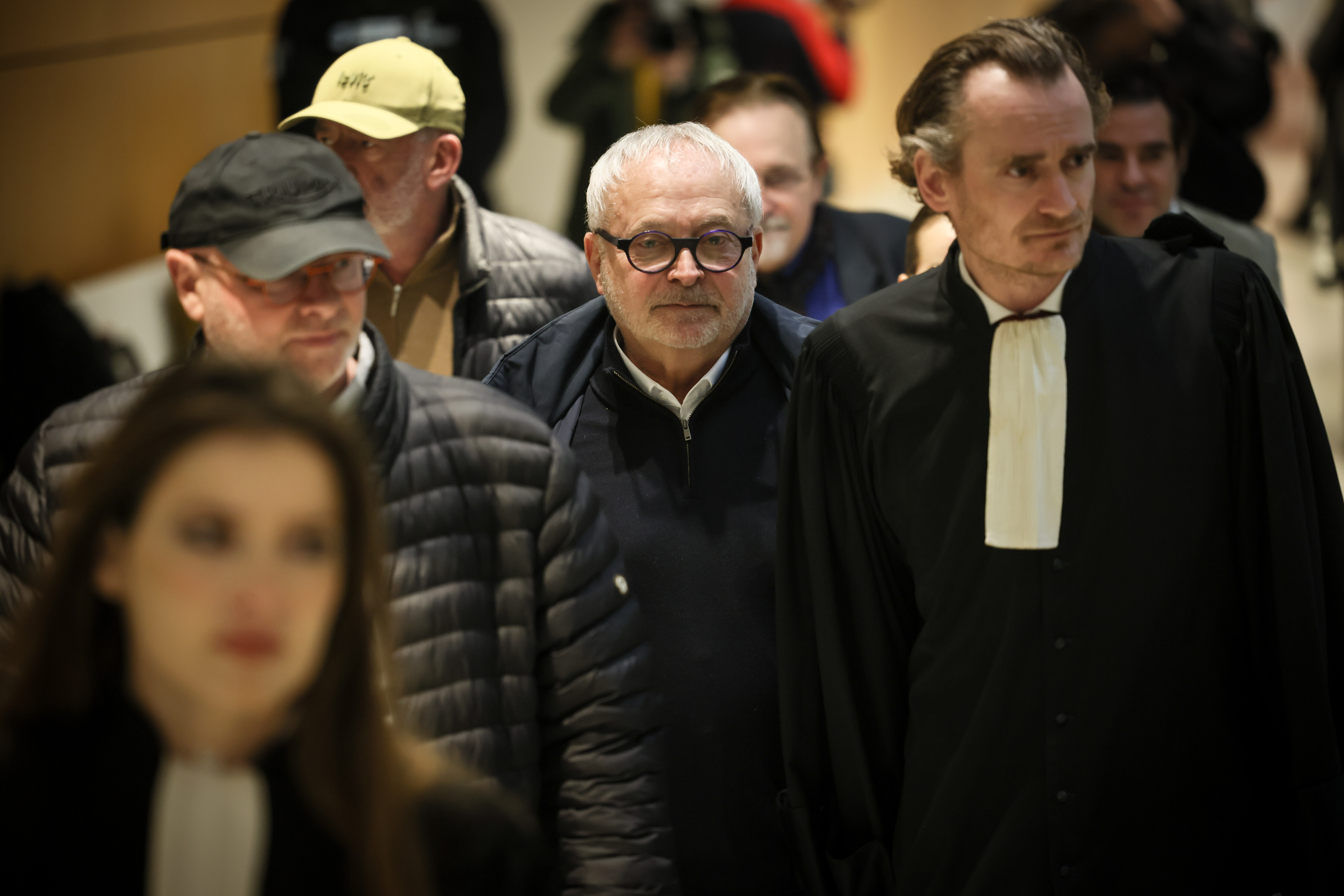 French former senator Joel Guerriau, center, and his lawyers Marie Roumiantseva, left, Henri Carpentier, right, arrive at the courtroom, in Paris, Monday, Jan. 26, 2026. (AP Photo/Thomas Padilla)
