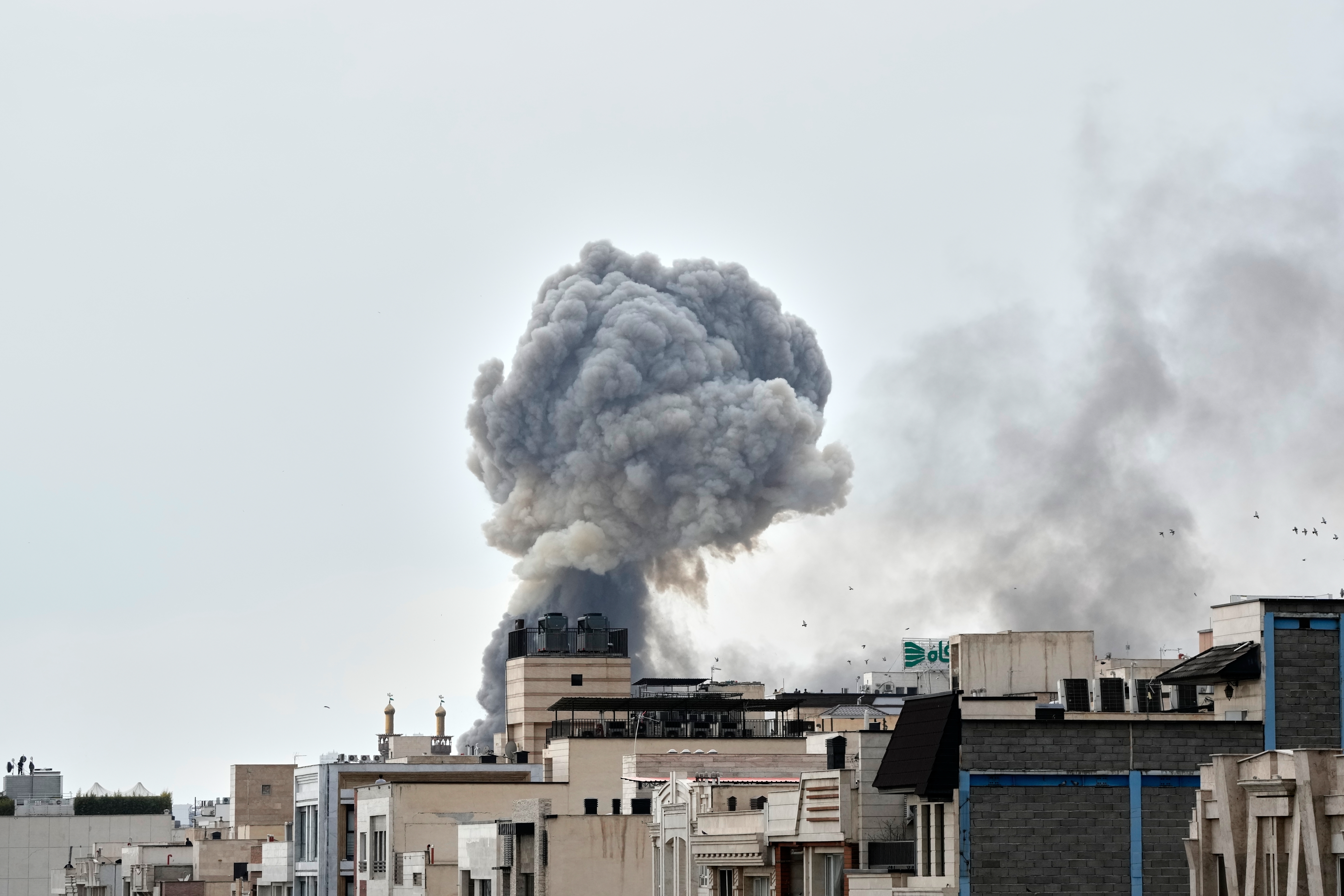 A plume of smoke rises after a strike in Tehran, Iran, Monday, March 2, 2026. (AP Photo/Vahid Salemi)