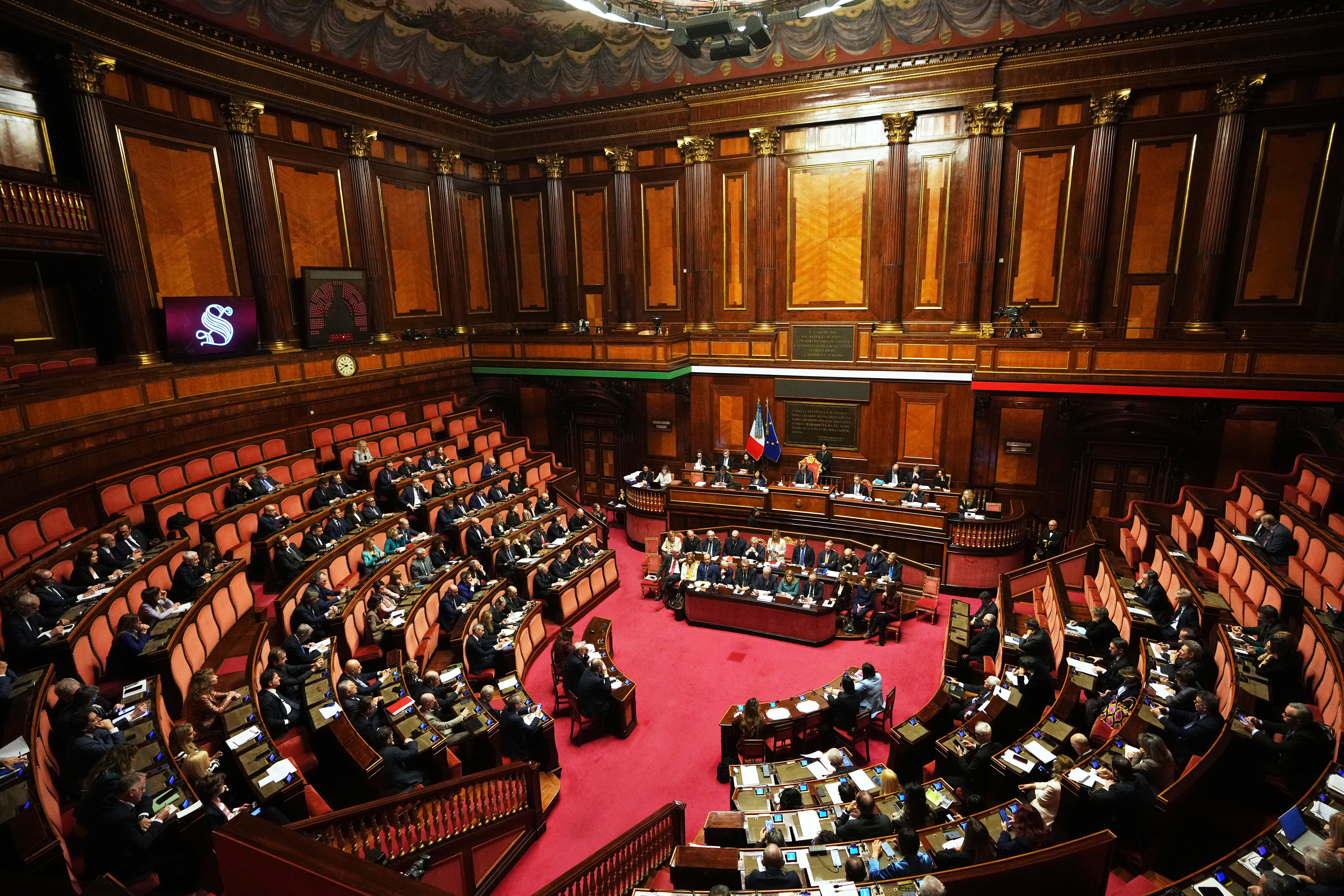 Italy's Prime Minister Giorgia Meloni, center, addresses the Senate regarding the conflict in Iran and the Gulf region, in Rome, Wednesday, March 11, 2026. (AP Photo/Alessandra Tarantino)