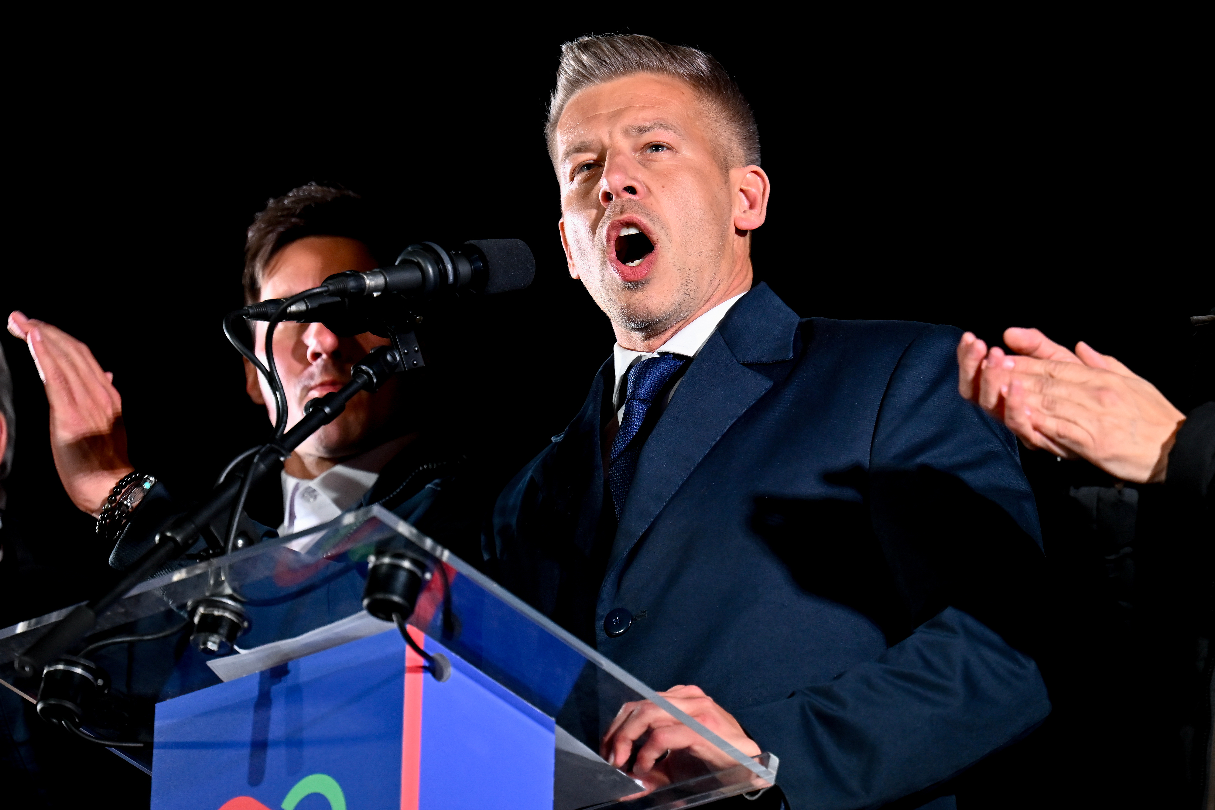 Peter Magyar, leader of the opposition Tisza party, speaks to his supporters following the announcement of the partial results of the parliamentary election, in Budapest, Hungary, Sunday, April 12, 2026. (AP Photo/Denes Erdos)