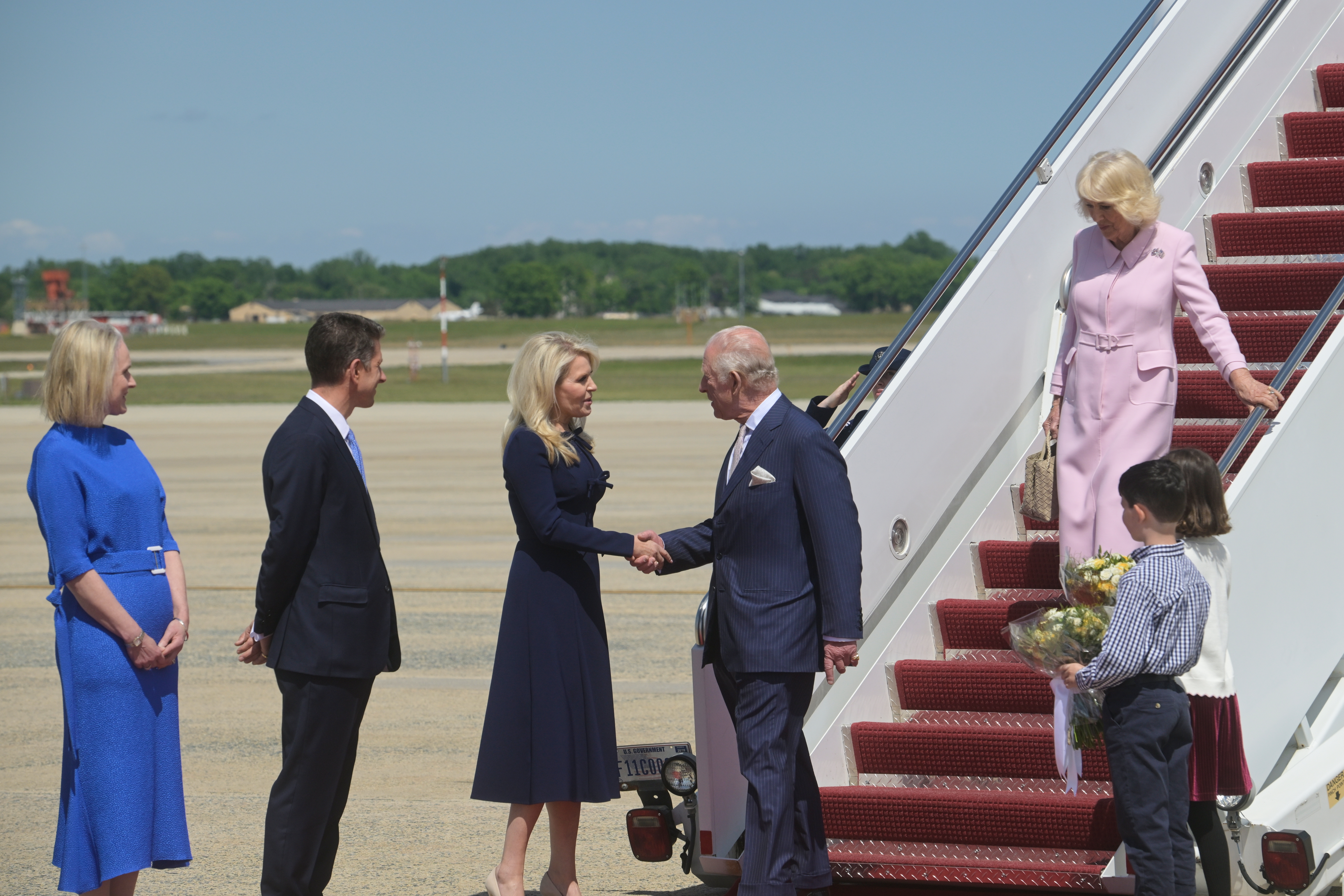King Charles III shakes hands with U.S. Chief of Protocol Monica Crowley