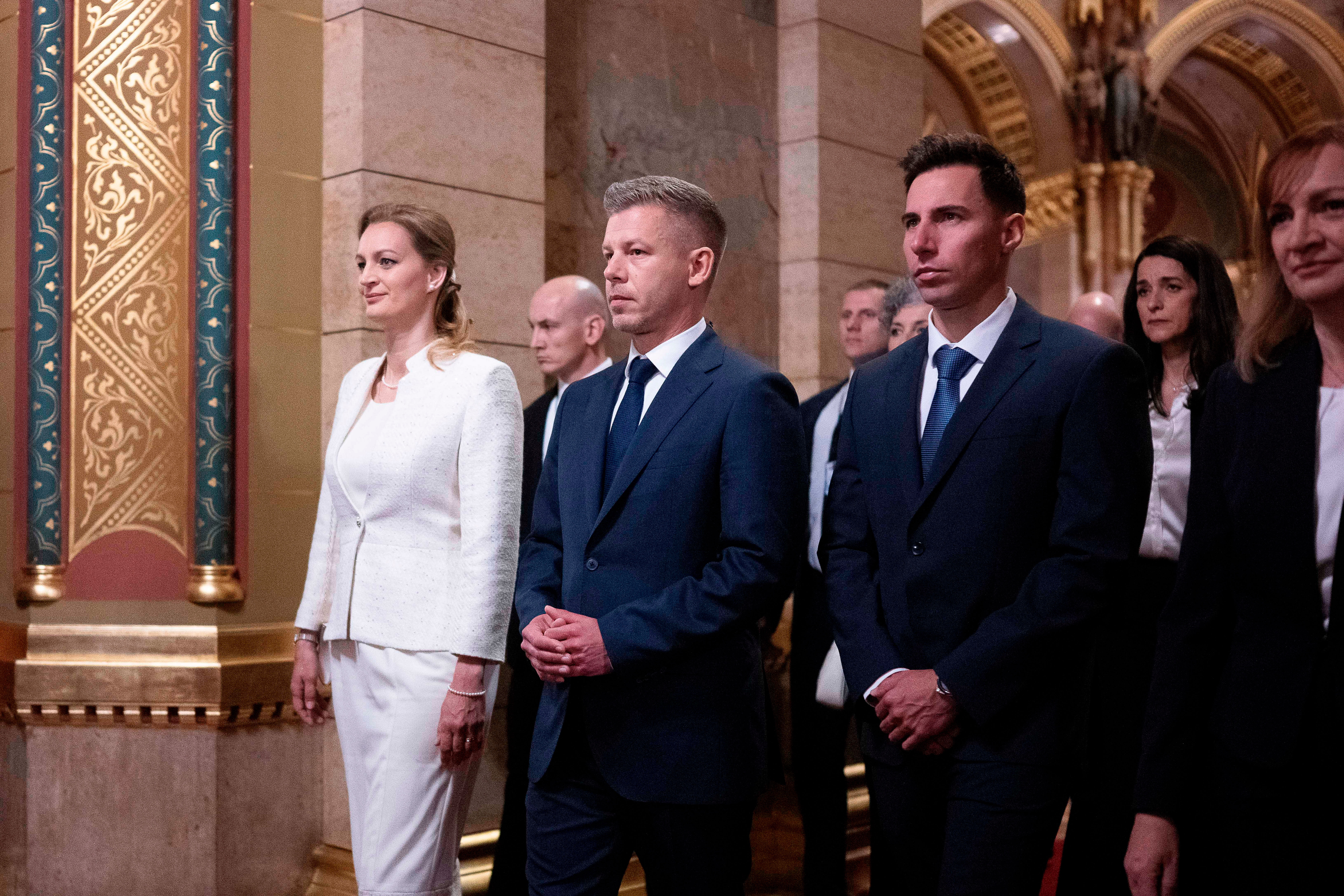 Hungarian Prime Minister-elect Peter Magyar, center, arrives with fellow lawmakers at the Parliament building in Budapest, Hungary, Saturday, May 9, 2026. (AP Photo/Denes Erdos)