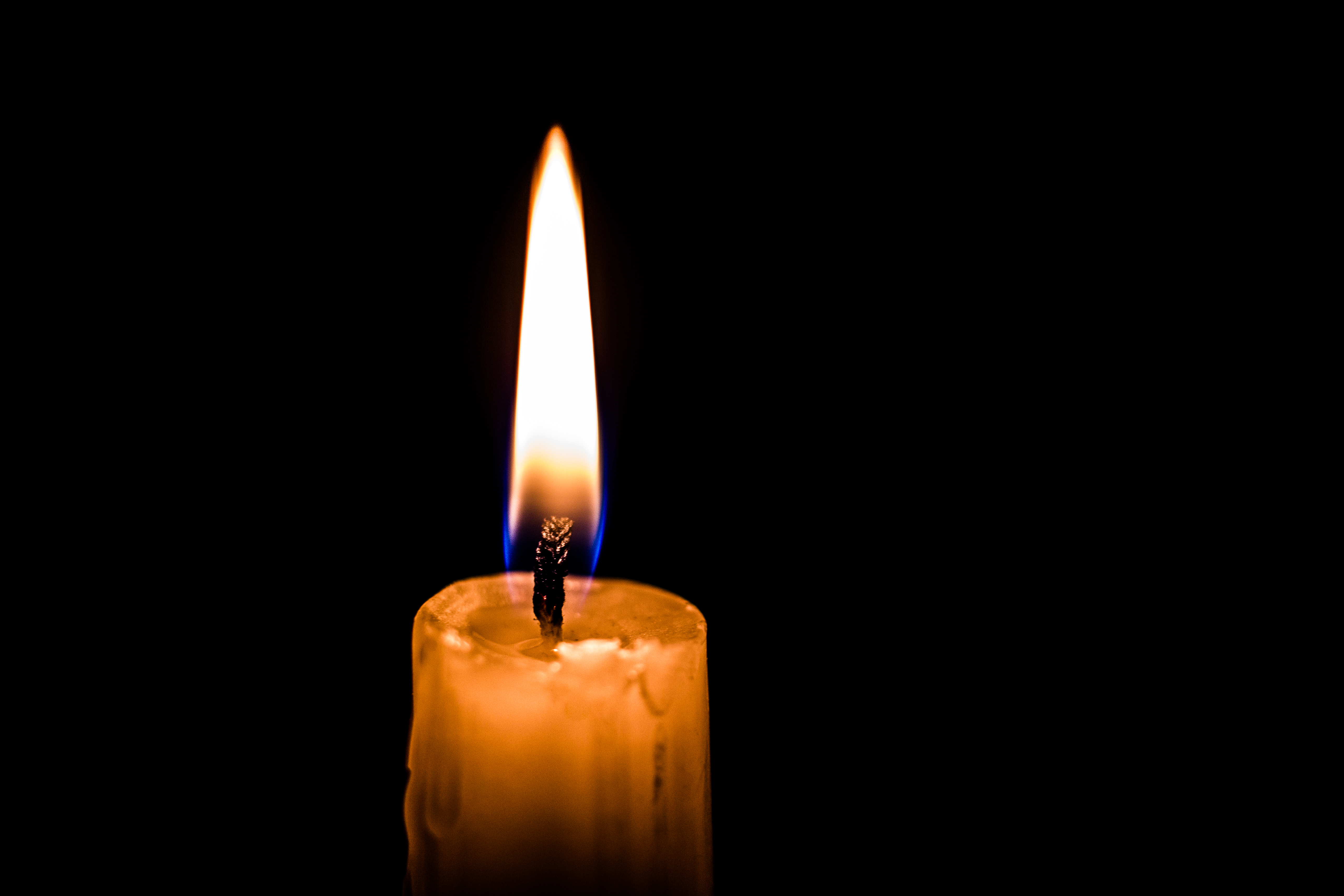 Candle,Flame,Close,Up,On,A,Black,Background
