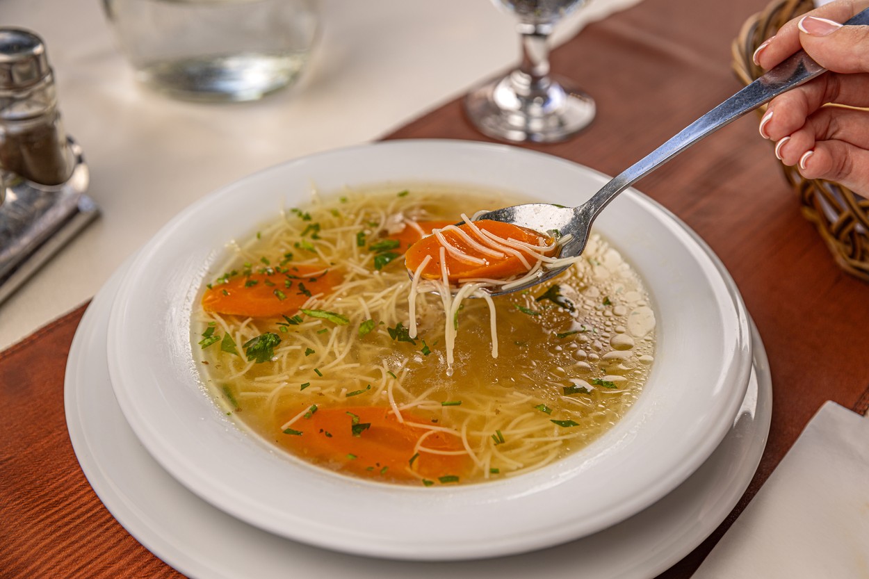 Woman eating fresh chicken noodle soup in restaurant,Image: 800648089, License: Royalty-free, Restrictions: , Model Release: no, Credit line: Cseh Ioan / Panthermedia / Profimedia