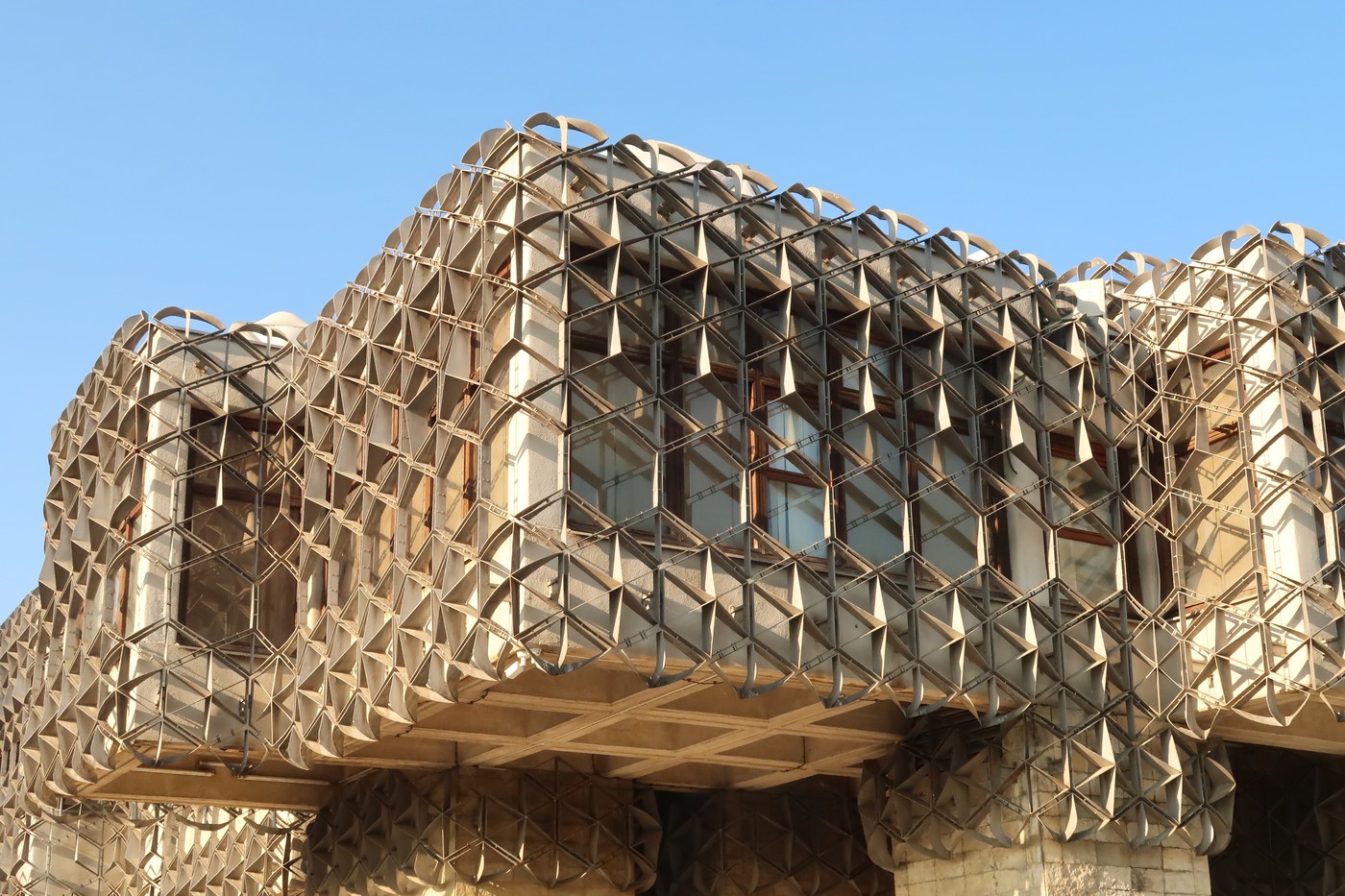 The cubic shapes that form the facade of the National University Library of Kosovo, covered by a metal grid, net, an example of socialist, brutalist architecture in the city center of Prishtina, Pristina, Kosovo