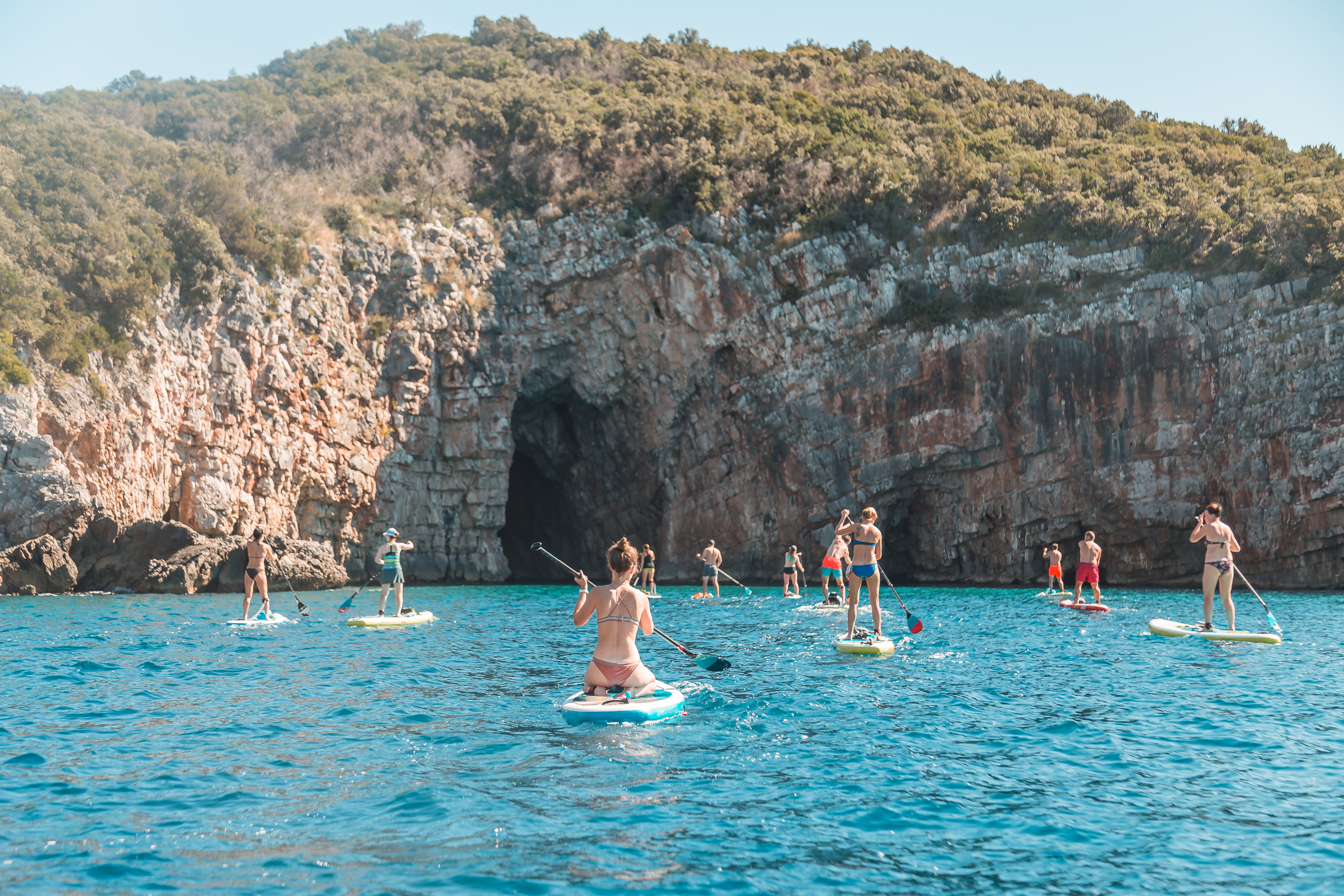 Tourists,With,Sup,Stand,Up,Paddle,Boards,Near,Blue,Cave,
