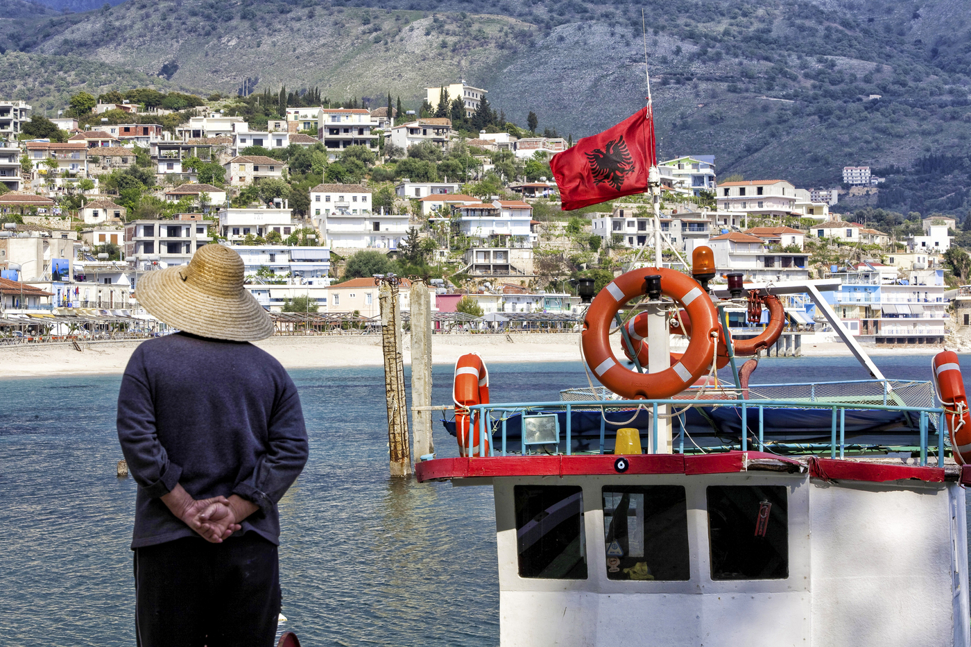 Town view of Himara in southern Albania, boat with Albanian flag, Himara, Qark Vlora, Albania,Image: 774108852, License: Rights-managed, Restrictions: , Model Release: no, Credit line: Arnulf Hettrich / imageBROKER / Profimedia