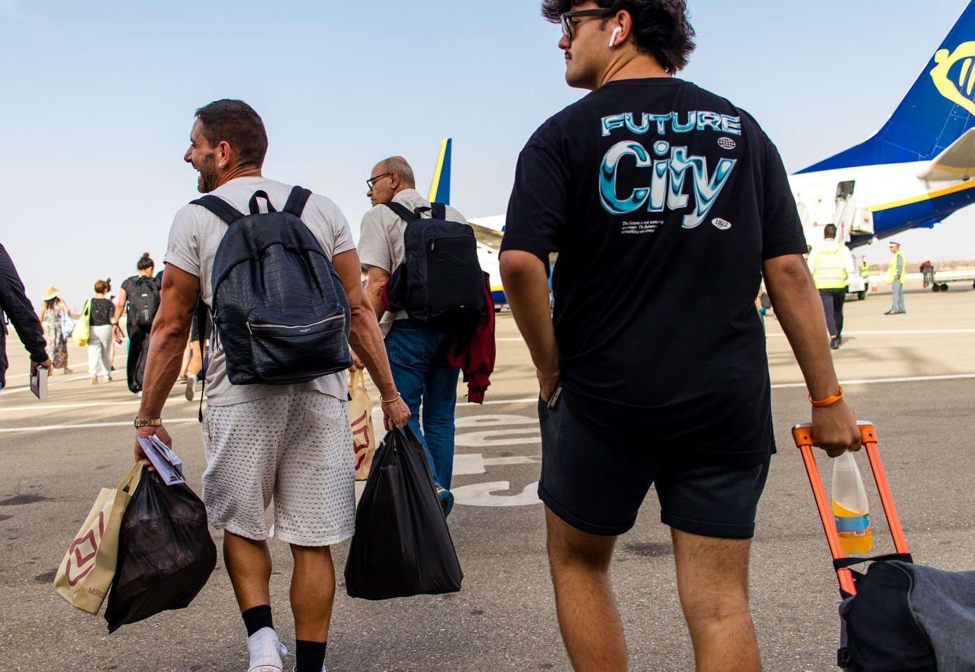 Essaouira, Morocco - August 29, 2023 Tourists taking a Ryanair airline flight at Essaouira airport in Morocco to Madrid in Spain. Ryanair serves many