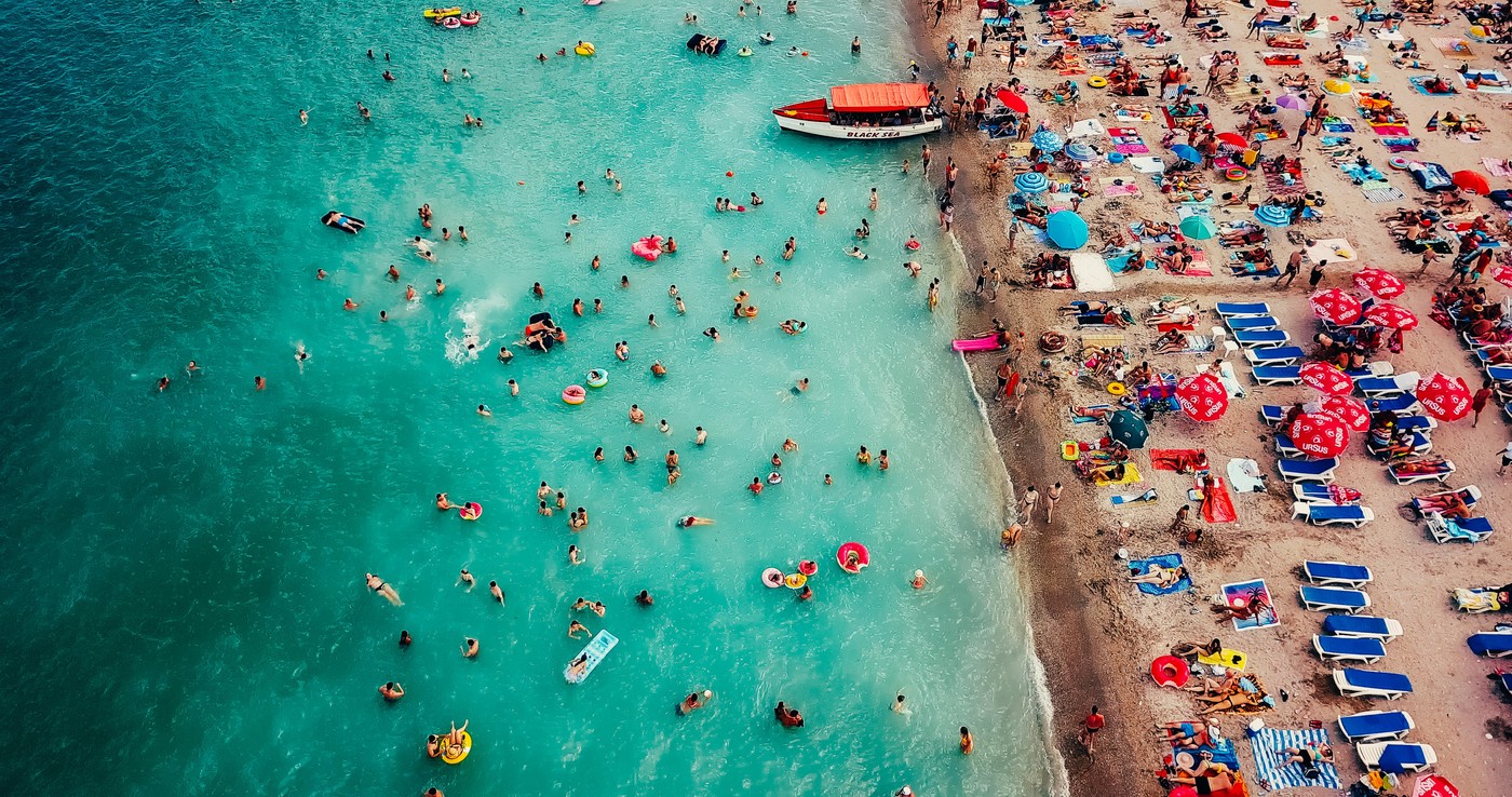 COSTINESTI, ROMANIA - JULY 15, 2018: Aerial View From Flying Drone Of People Crowd Relaxing On Costinesti Beach In Romania