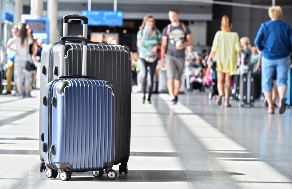Two plastic travel suitcases in the airport hall.,Image: 305528122, License: Royalty-free, Restrictions: , Model Release: no, Credit line: Z Jan / Panthermedia / Profimedia