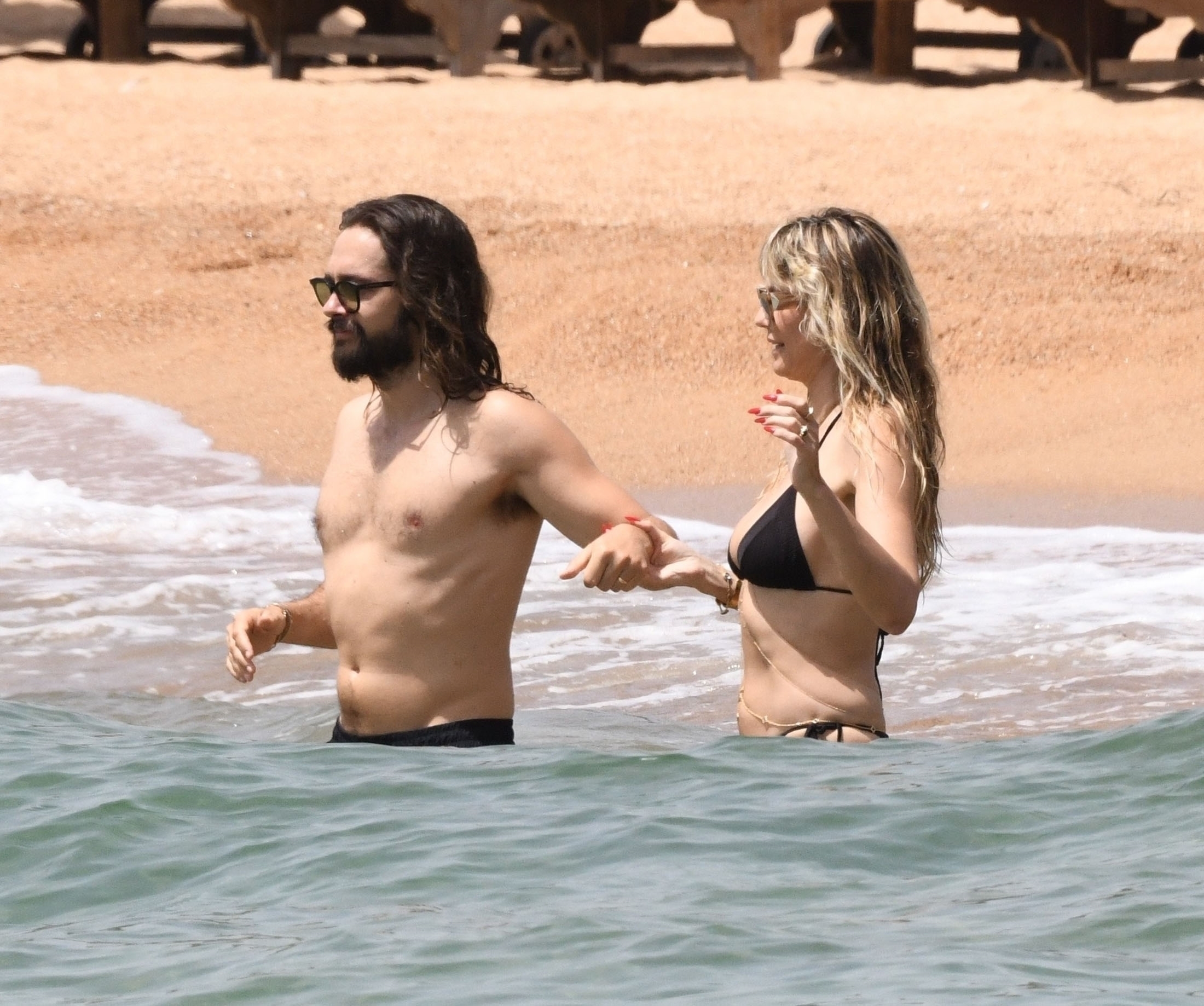 *EXCLUSIVE* *WEB MUST CALL FOR PRICING* Heidi Klum and Tom Kaulitz pack on the PDA in the sweltering Italian heat during a day at the beach at Cala di Volpe in Sardinia.