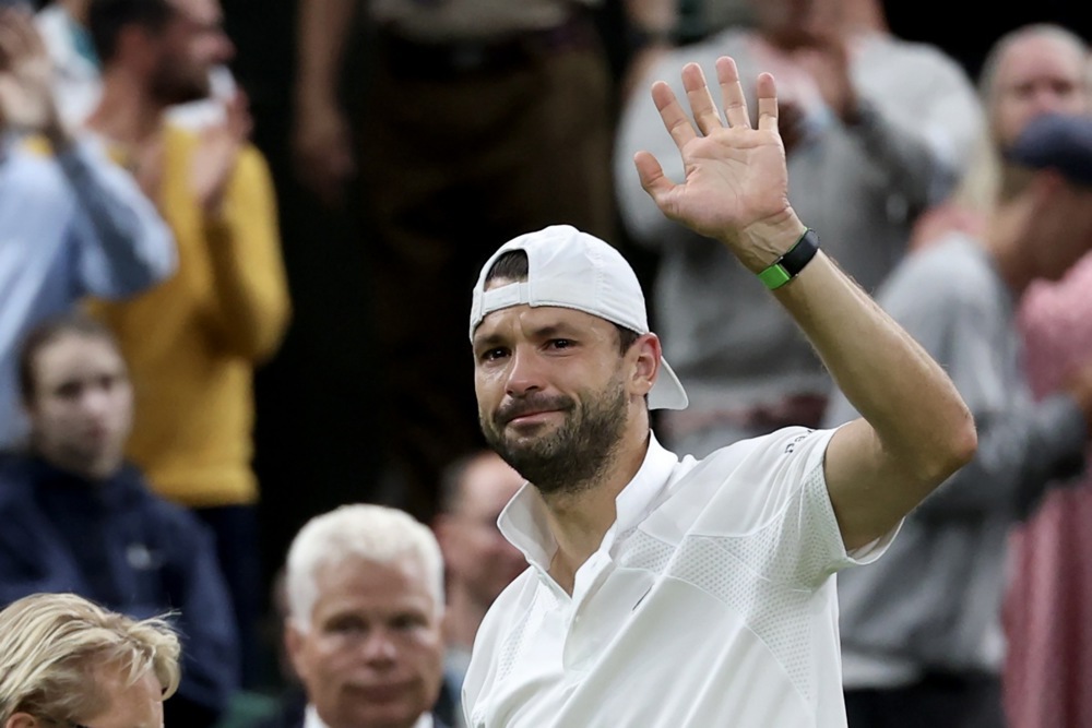 epa12223358 Grigor Dimitrov of Bulgaria greets spectators after surrendering his Men's Singles Round of 16 match against Jannik Sinner of Italy at the Wimbledon Championships, Wimbledon, Britain, 07 July 2025.  EPA/NEIL HALL  EDITORIAL USE ONLY