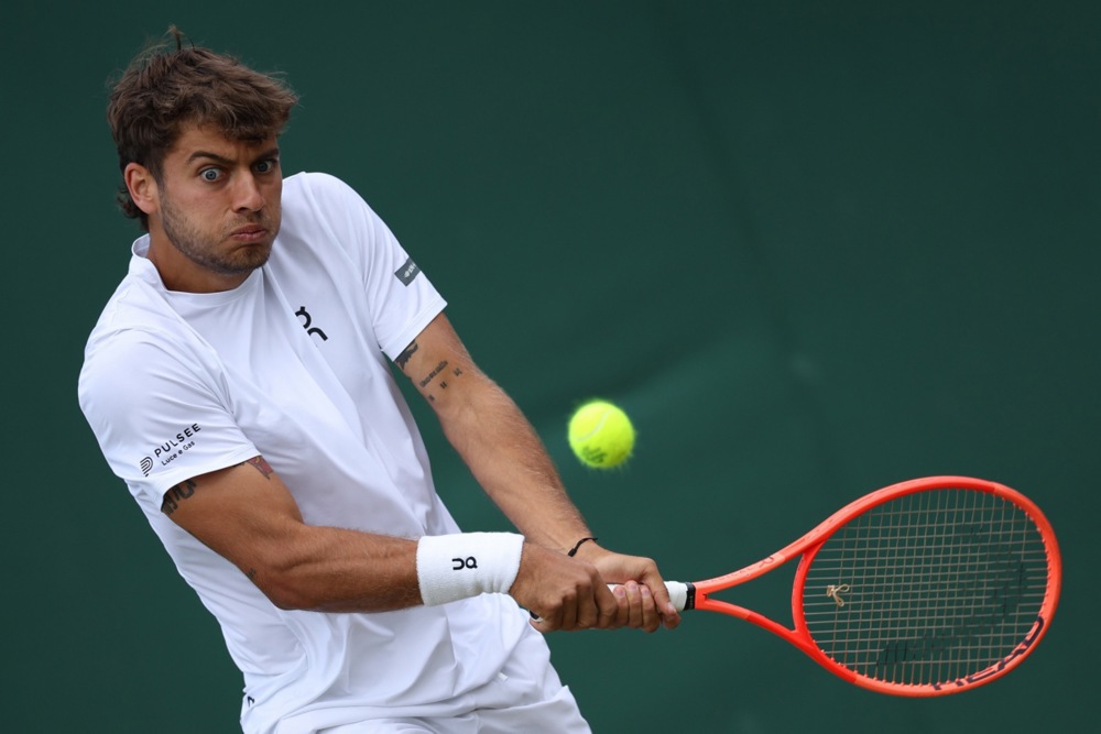 epa12221882 Flavio Cobolli of Italy in action during the Men's Singles Fourth Round match against Marin Cilic of Croatia at the Wimbledon Championships, Wimbledon, Britain, 07 July 2025.  EPA/ADAM VAUGHAN  EDITORIAL USE ONLY