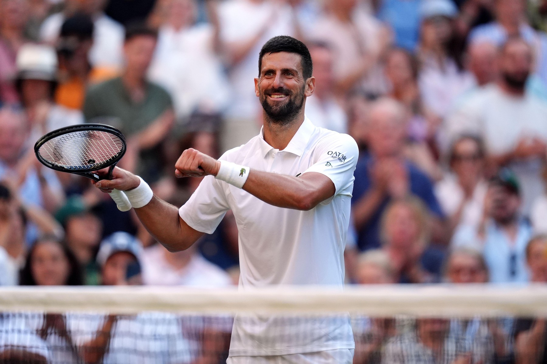 Novak Djokovic celebrates his victory over Flavio Cobolli following their Gentlemen's Singles match on day ten of the 2025 Wimbledon Championships at the All England Lawn Tennis and Croquet Club, London. Picture date: Wednesday July 9, 2025.