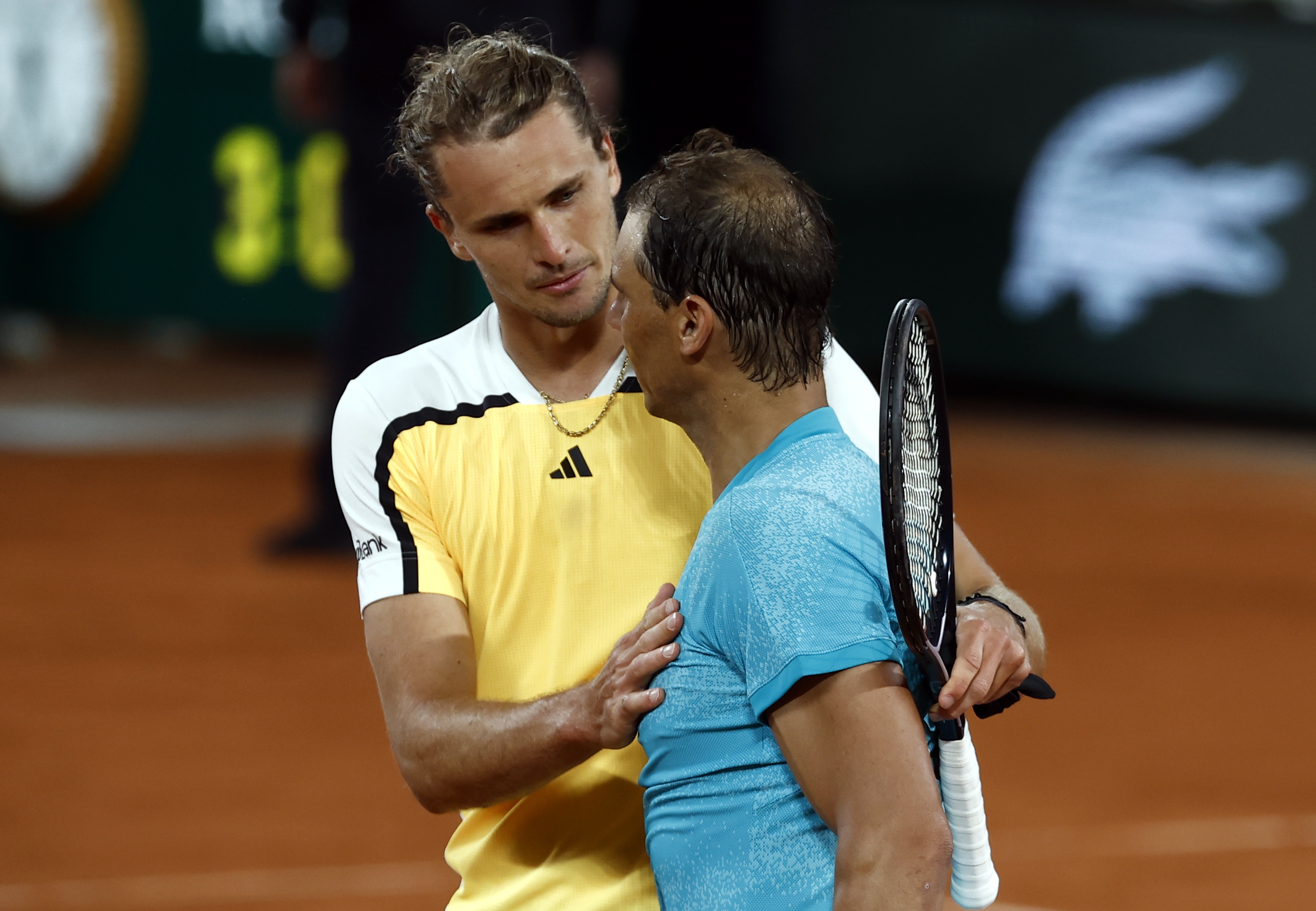 epa11374001 Rafael Nadal of Spain (R) reacts with Alexander Zverev of Germany after losing their Men's Singles 1st round match during the French Open Grand Slam tennis tournament at Roland Garros in Paris, France, 27 May 2024.  EPA-EFE/MOHAMMED BADRA