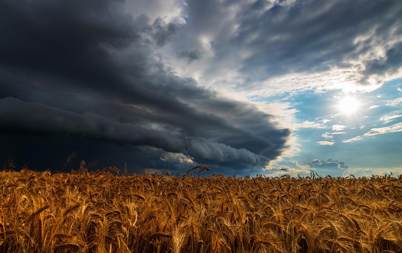 WEATHER Dramatic black rain clouds over fields and country road 20