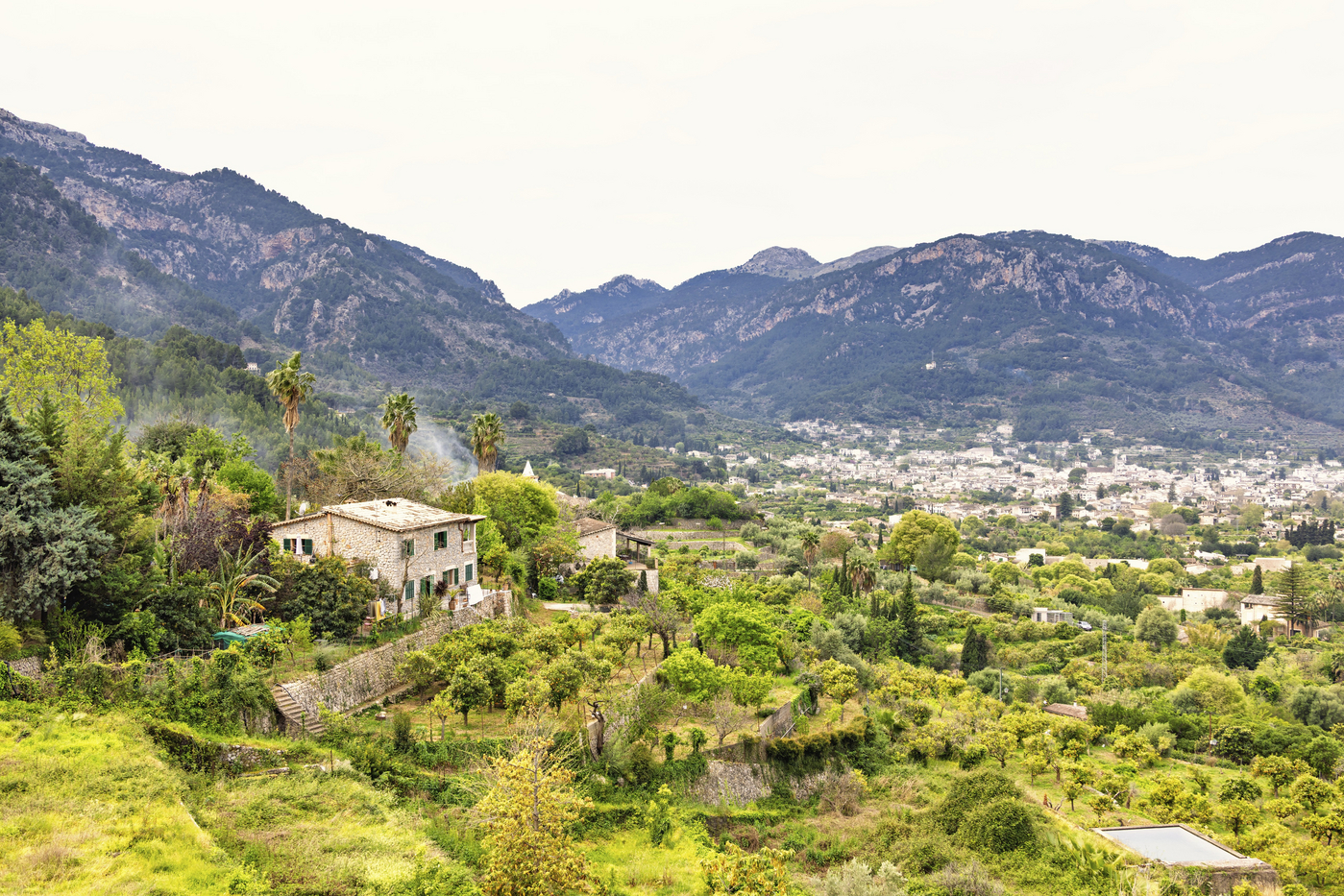 View at mountain village in a valley with lush green orchards and farms, Sóller, Mallorca, Spain,Image: 1034577613, License: Royalty-free, Restrictions: , Model Release: no, Credit line: Lars Johansson / imageBROKER / Profimedia
