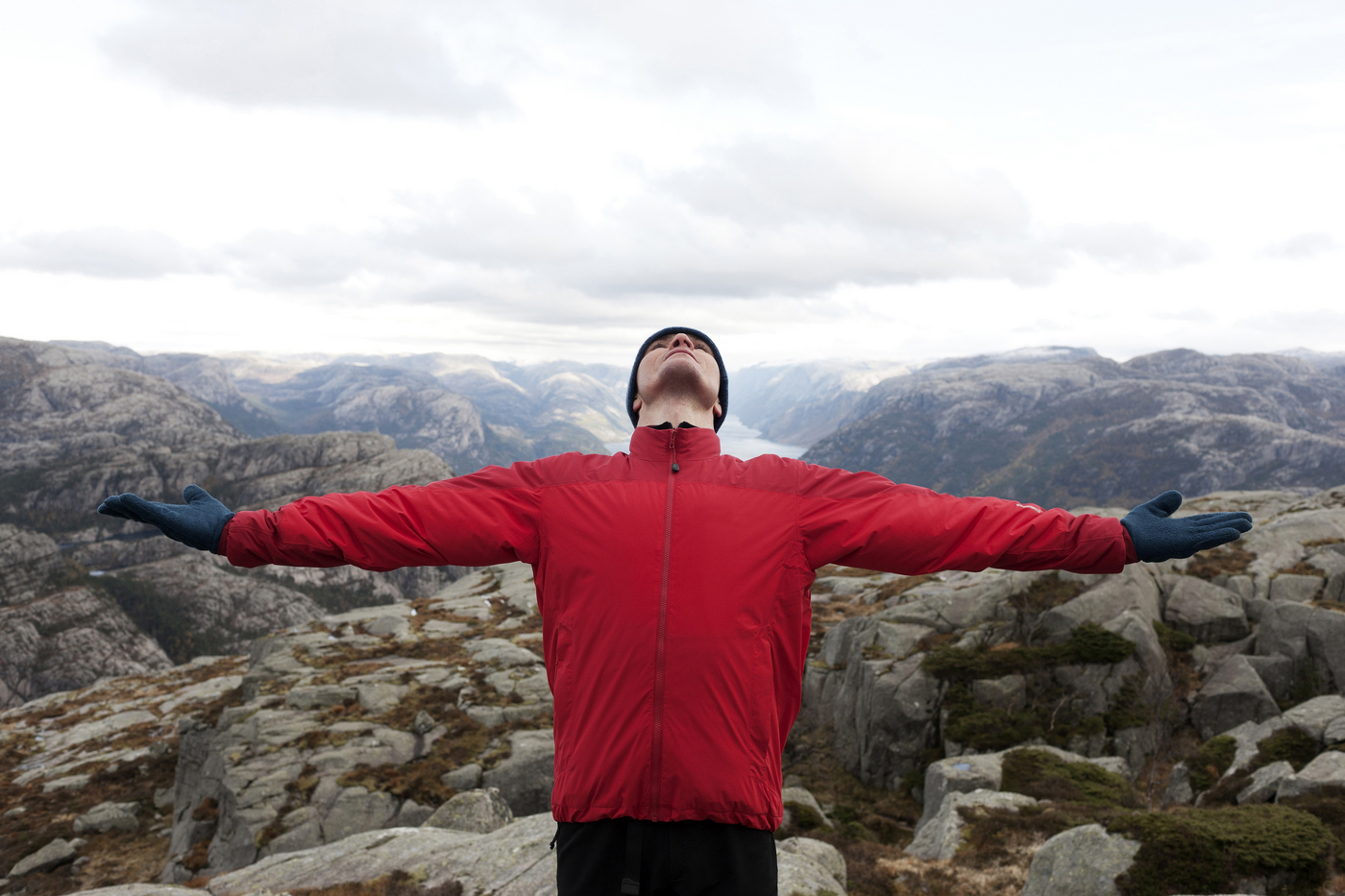 Man Standing On Edge Of Mountain With Arm Extended,Image: 1027072568, License: Royalty-free, Restrictions: , Model Release: yes, Credit line: Elisabeth Hoiberg / imageBROKER / Profimedia