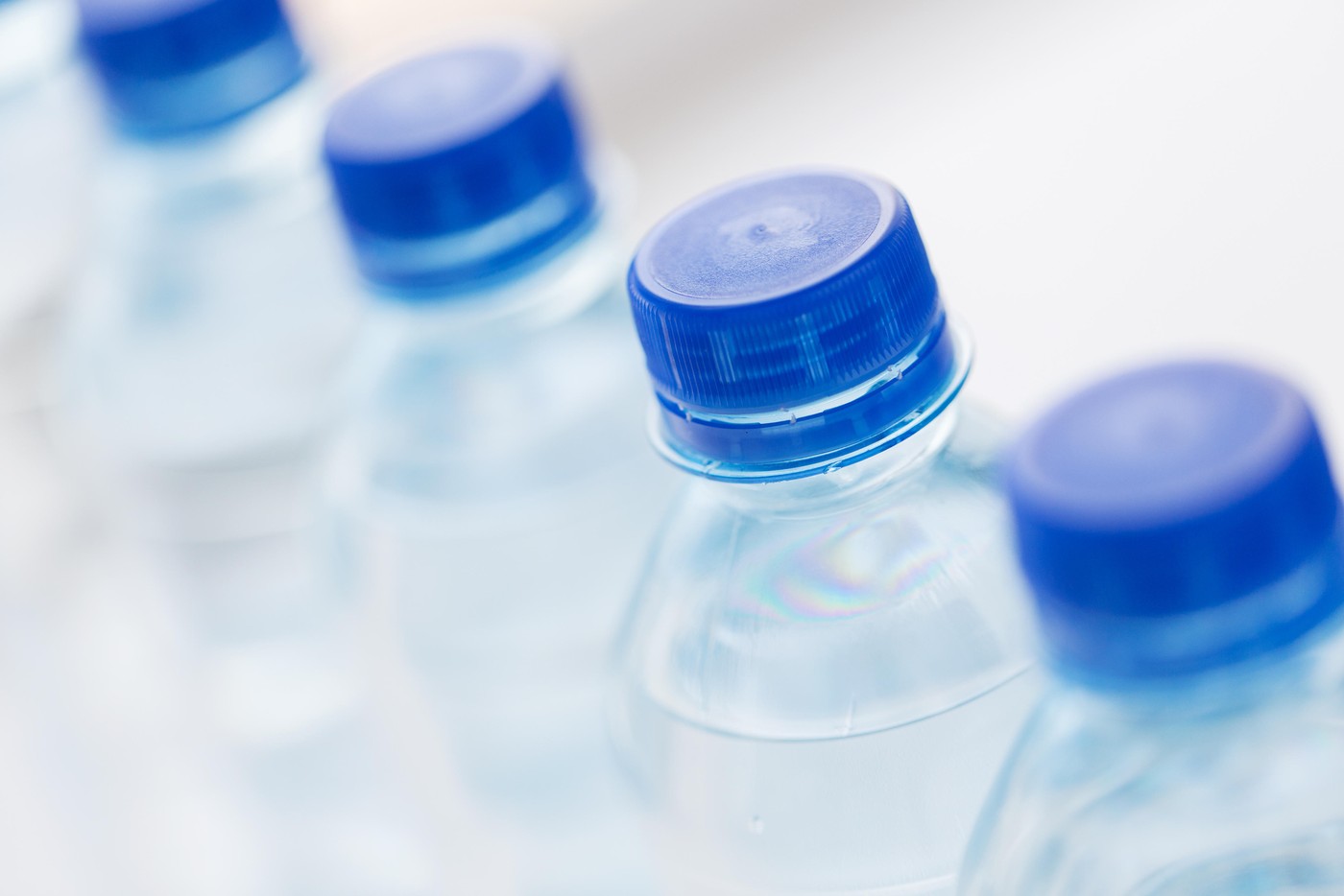 close up of plastic bottles with drinking water