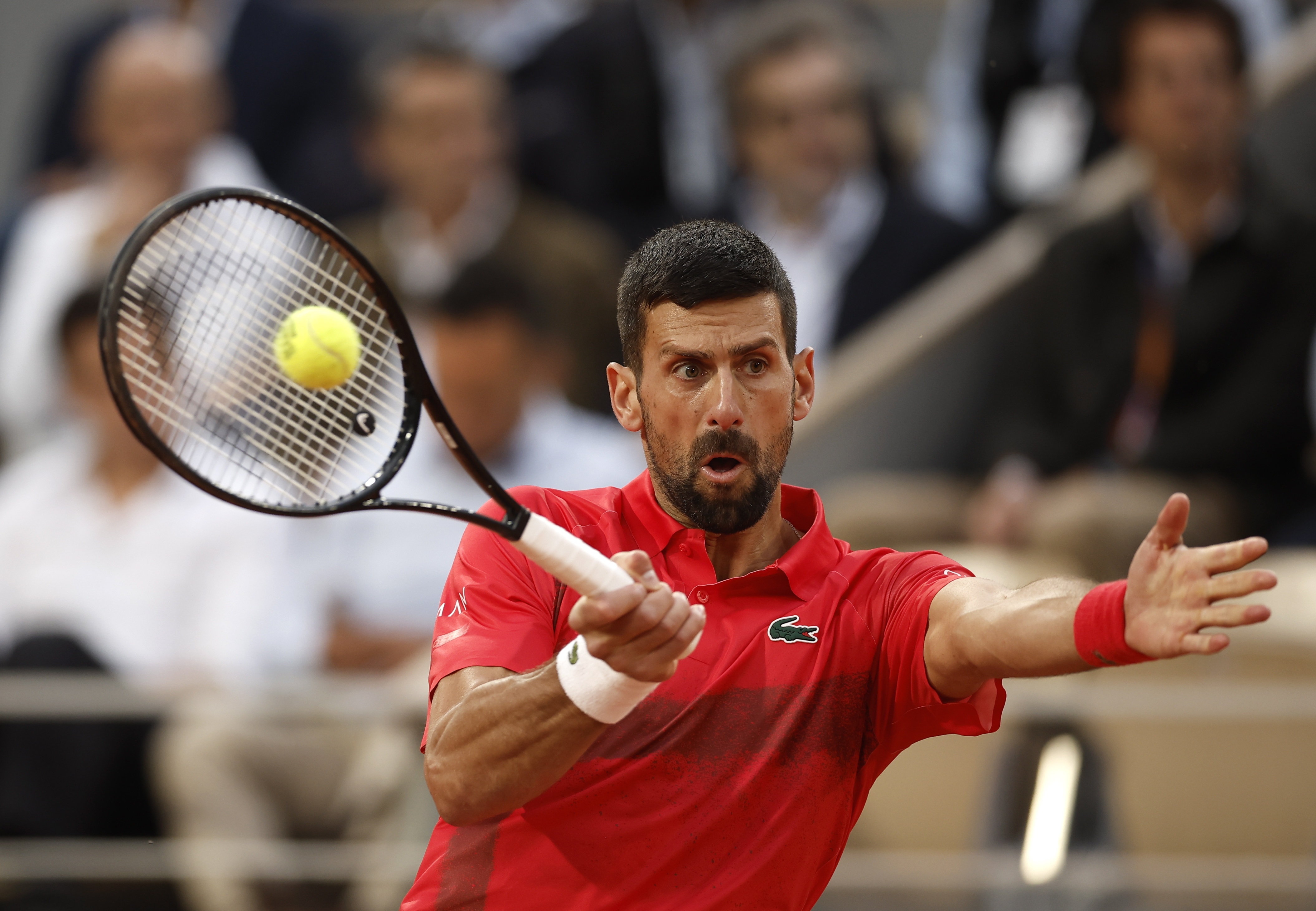 epa12155818 Novak Djokovic of Serbia in action during his Men's singles quarter-finals match against Alexander Zverev of Germany at the French Open Grand Slam tennis tournament at Roland Garros in Paris, France, 04 June 2025.  EPA-EFE/YOAN VALAT