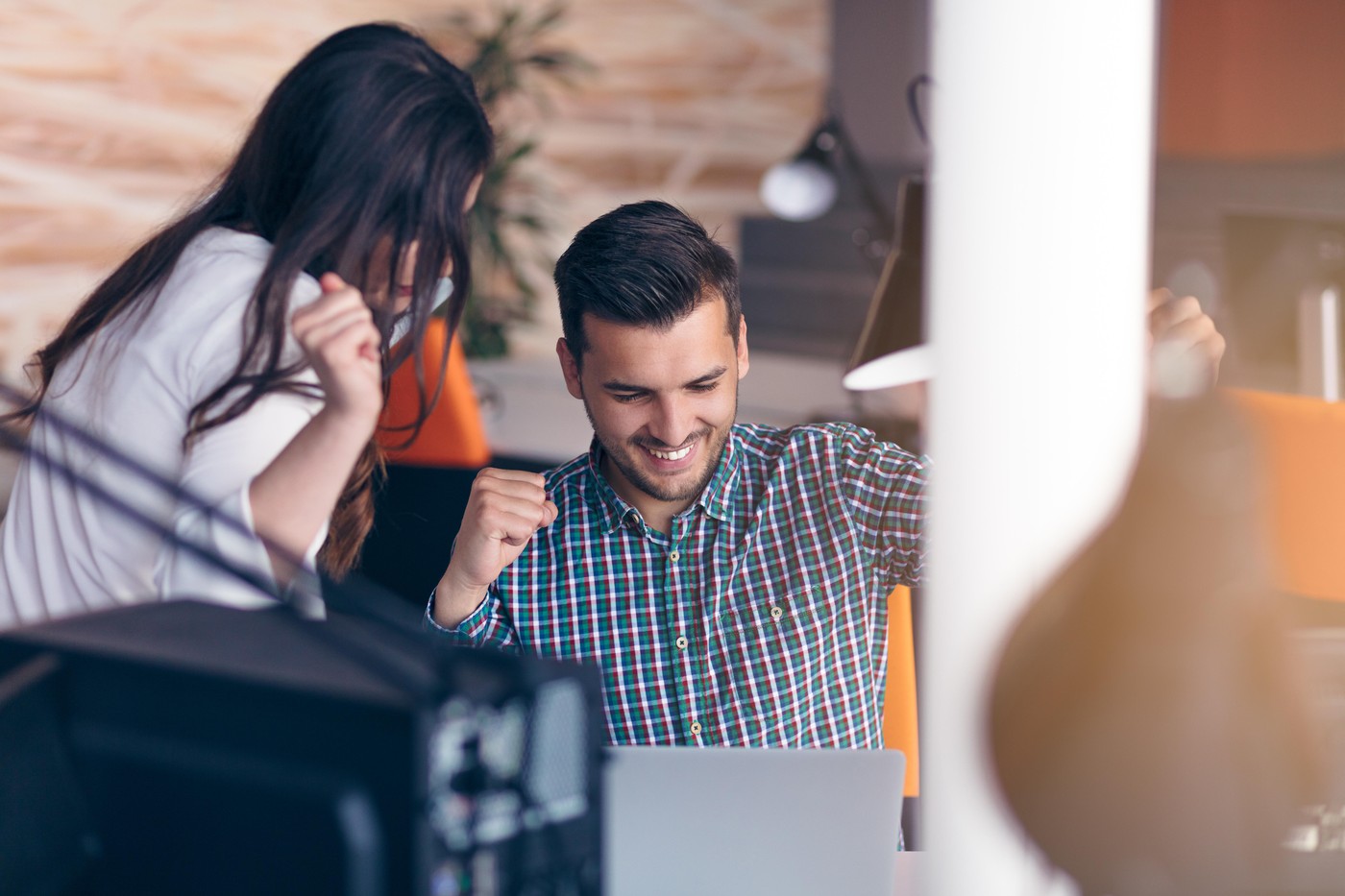 Young couple working together on a laptop in the office. Teamwork concepts,Image: 346935332, License: Royalty-free, Restrictions: , Model Release: yes, Credit line: FS-Stock / Alamy / Profimedia