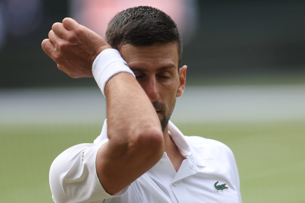 epa11474651 Novak Djokovic of Serbia reacts during his Men's Singles semifinal match against Lorenzo
Musetti of Italy at the Wimbledon Championships, Wimbledon, Britain, 12 July 2024.  EPA-EFE/NEIL HALL  EDITORIAL USE ONLY