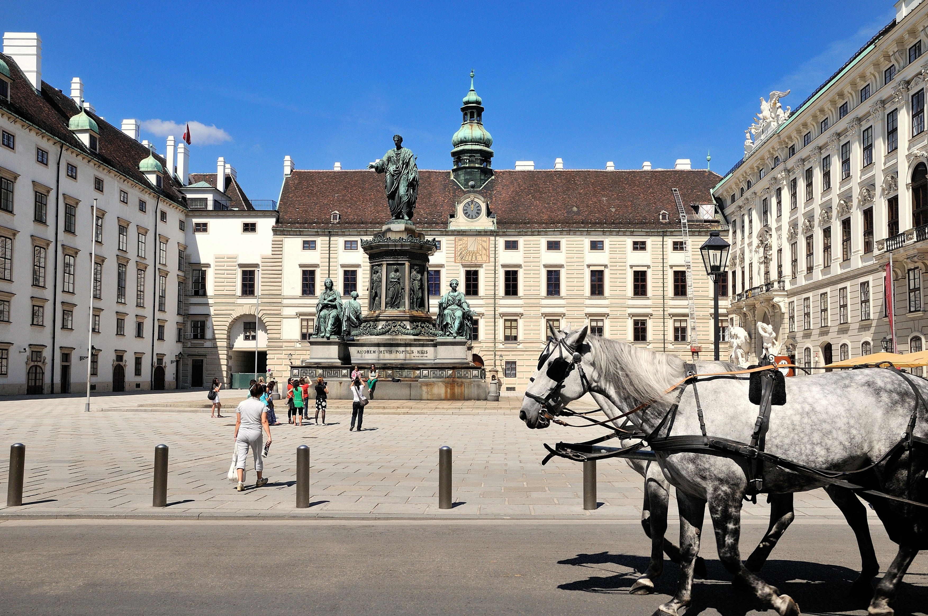 Hofburg palace with horses in foreground, centre of old historic Vienna Austria Europe