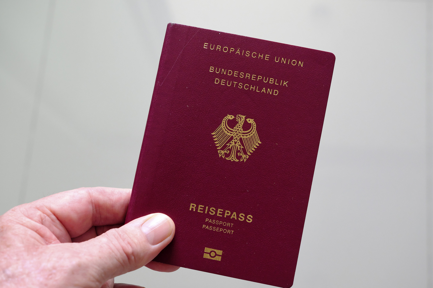 Hand holds German passport,Image: 978265502, License: Rights-managed, Restrictions: , Model Release: no, Credit line: MAL / imageBROKER / Profimedia