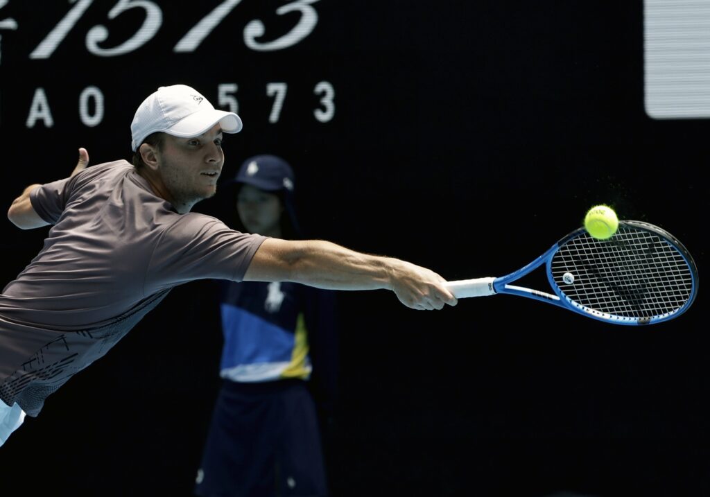epa11827602 Miomir Kecmanovic of Serbia in action during his Men's Singles round 2 match against Hubert Hurkacz of Poland at the Australian Open tennis tournament in Melbourne, Australia, 16 January 2025.  EPA-EFE/ROLEX DELA PENA