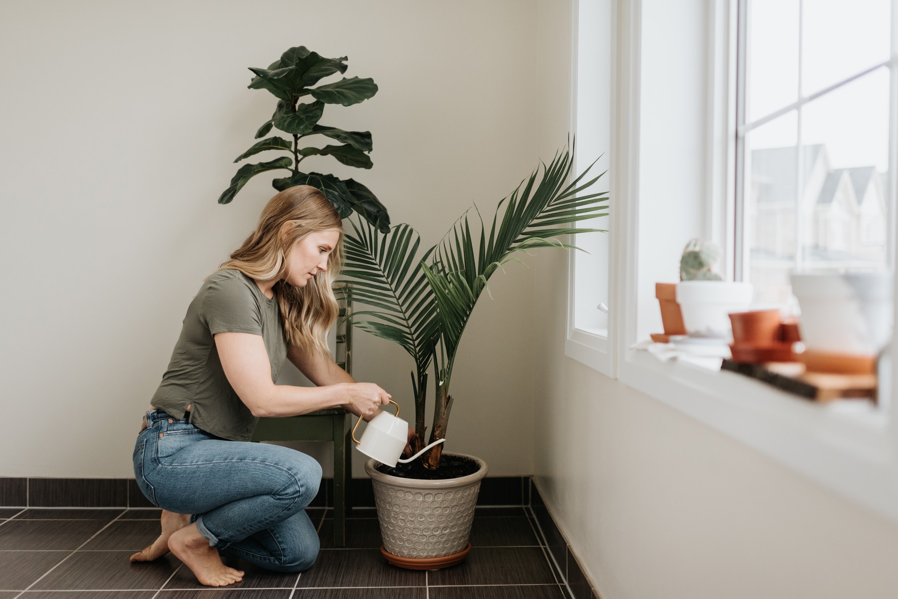 Woman watering house plants