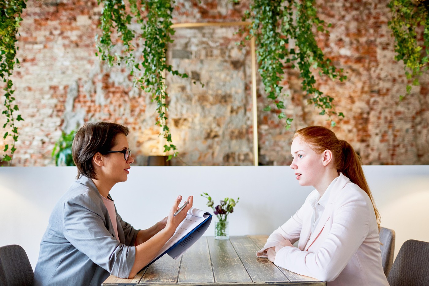 Young applicant answering questions of employer during appointment in cafe,Image: 351543829, License: Royalty-free, Restrictions: , Model Release: yes, Credit line: Dmitriy Shironosov / Alamy / Alamy / Profimedia