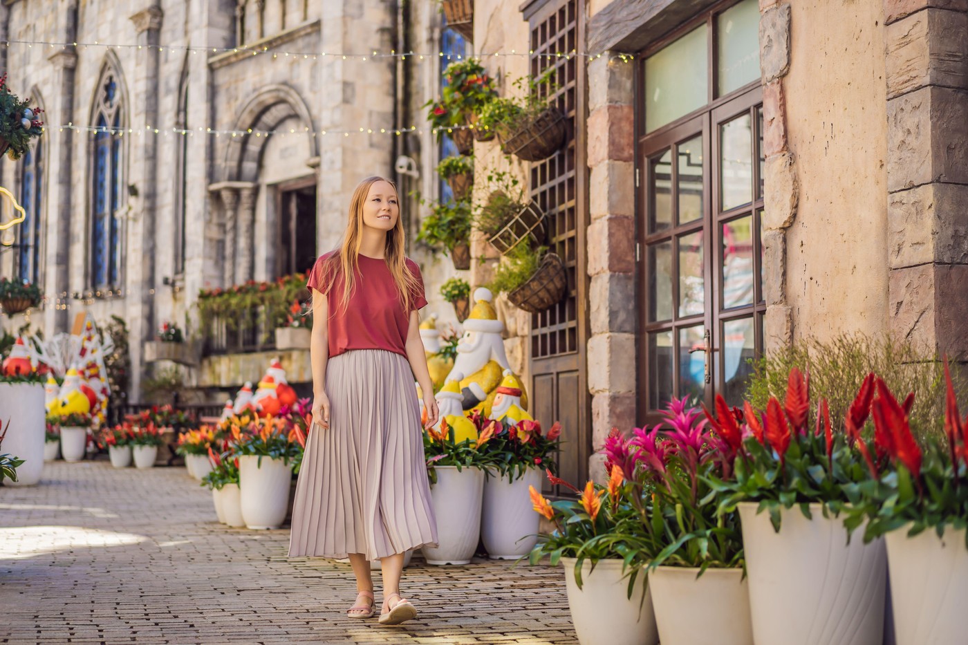 Young woman tourist walks down the street in a European city after the end of COVID-19 coronavirus. quarantine is over.,Image: 594239003, License: Royalty-free, Restrictions: , Model Release: no, Credit line: Elizaveta Galitckaia / Alamy / Profimedia