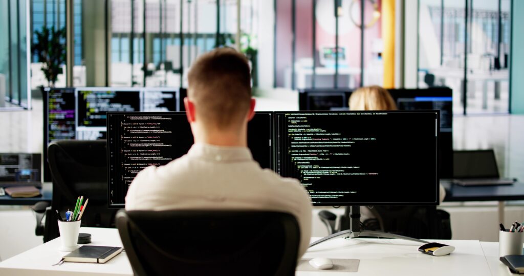 Software Programmer Or Coder Man Using Office Computer,Image: 867414329, License: Royalty-free, Restrictions: , Model Release: yes, Credit line: Andriy Popov / Panthermedia / Profimedia