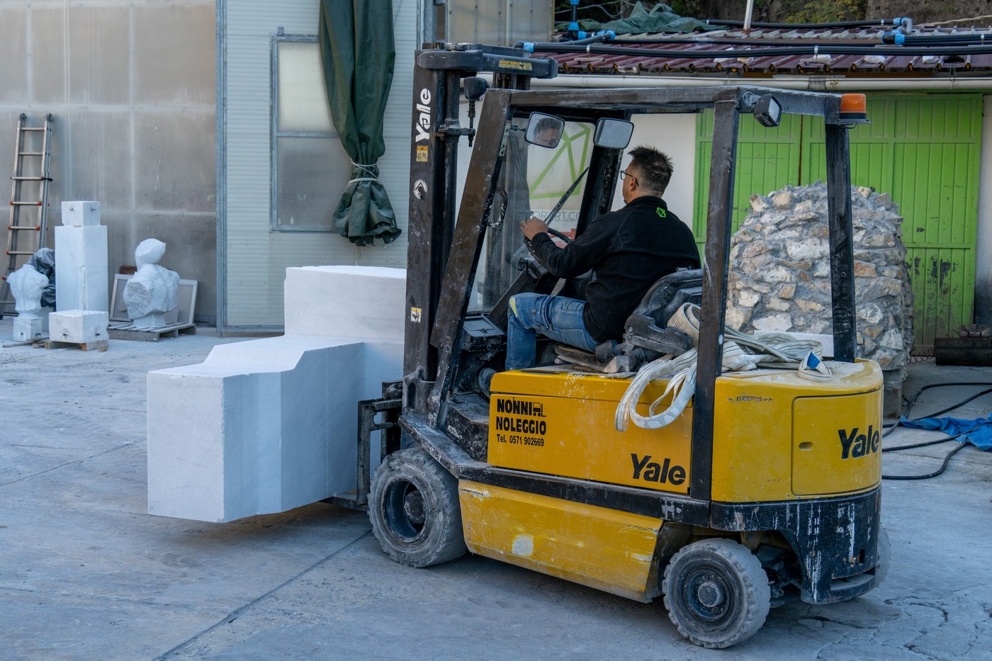 A worker at a marble carving studio moves a block of cut marble with a forklift.  Fantiscritti, Carrara, Italy.,Image: 950901771, License: Rights-managed, Restrictions: , Model Release: no, Credit line: Jon G. Fuller / VWPics / Profimedia
