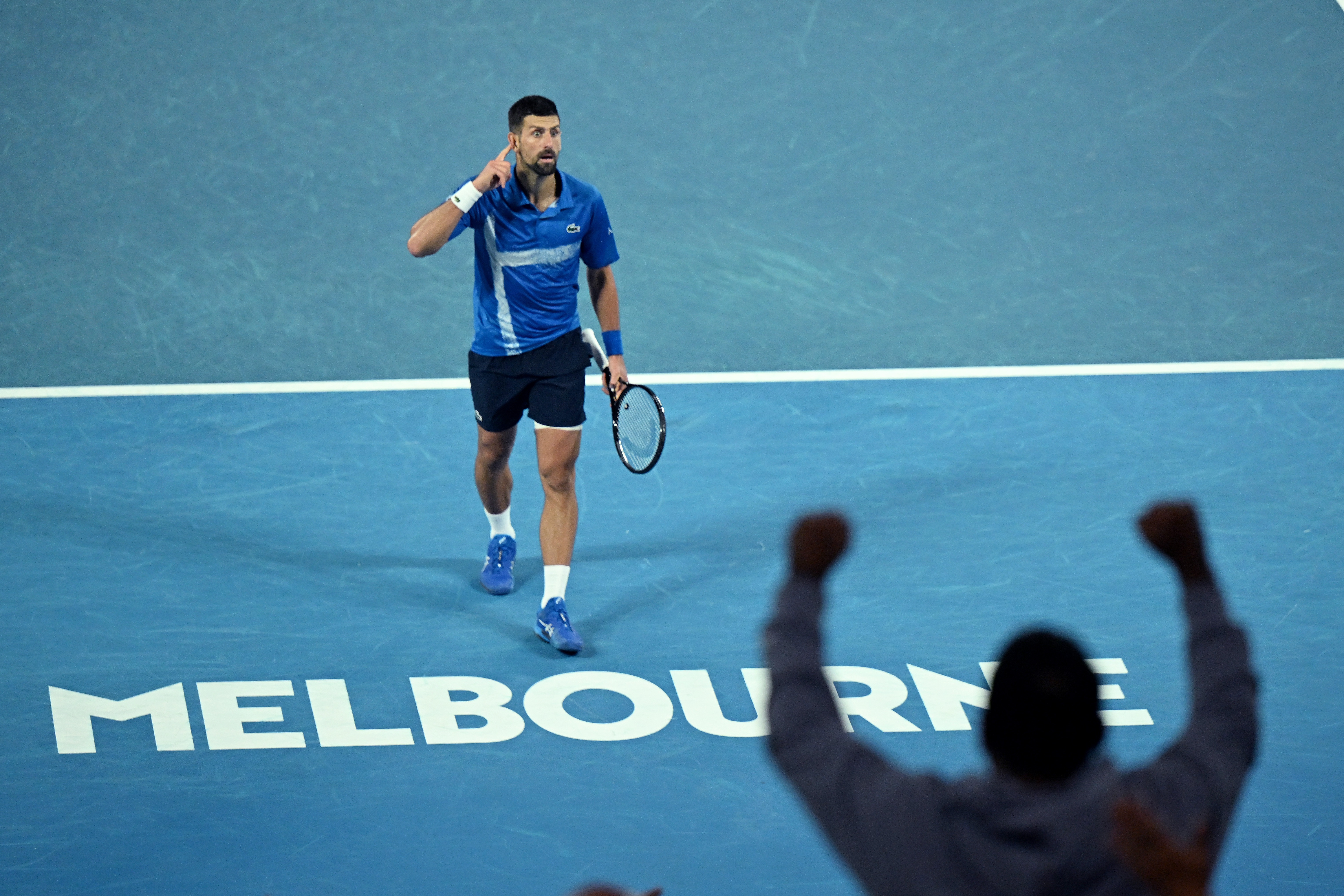epa11842005 Novak Djokovic of Serbia gestures during his Men's Singles quarterfinal match against Carlos Alcaraz of Spain at the Australian Open tennis tournament in Melbourne, Australia, 21 January 2025.  EPA-EFE/LUKAS COCH  AUSTRALIA AND NEW ZEALAND OUT