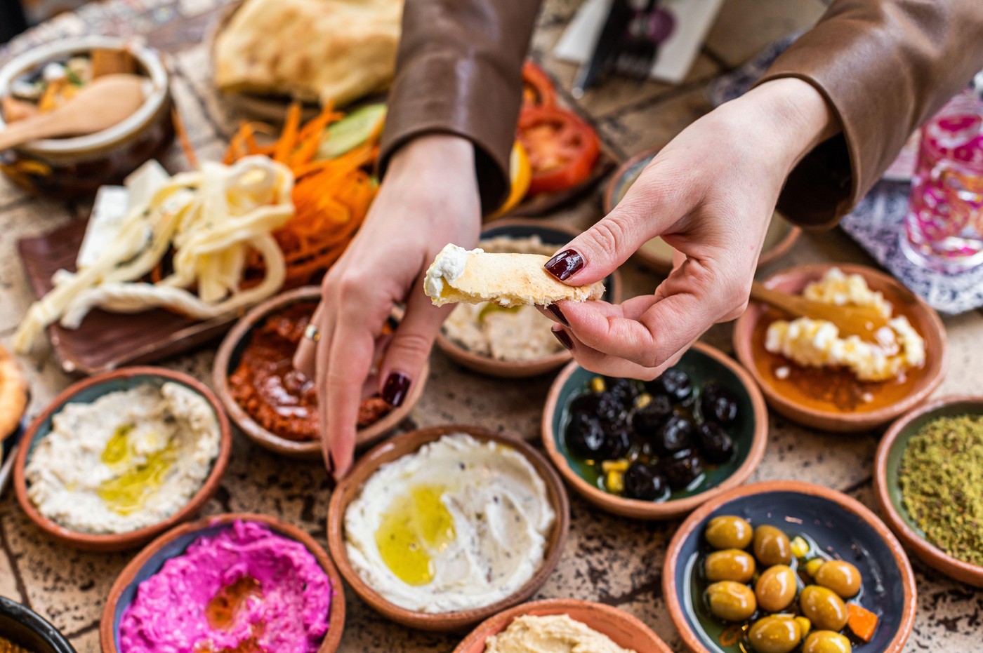 Women eating Traditional Turkish Village Breakfast served in restaurant. Top view.,Image: 644177196, License: Royalty-free, Restrictions: , Model Release: no, Credit line: Vladimir Mironov / Alamy / Profimedia