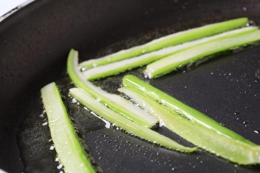 Strips of celery being stir fried in a frying pan,Image: 90030866, License: Rights-managed, Restrictions: , Model Release: no, Credit line: Afis / Digifoodstock / Profimedia