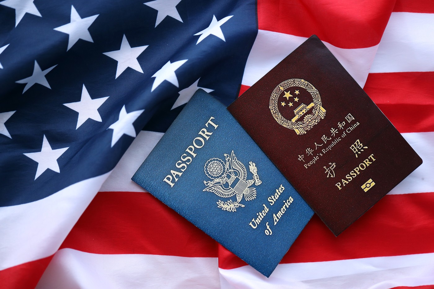 Passport of China Republic with US Passport on United States of America folded flag close up,Image: 875949769, License: Royalty-free, Restrictions: , Model Release: no, Credit line: Mykhailo Polenok / Panthermedia / Profimedia