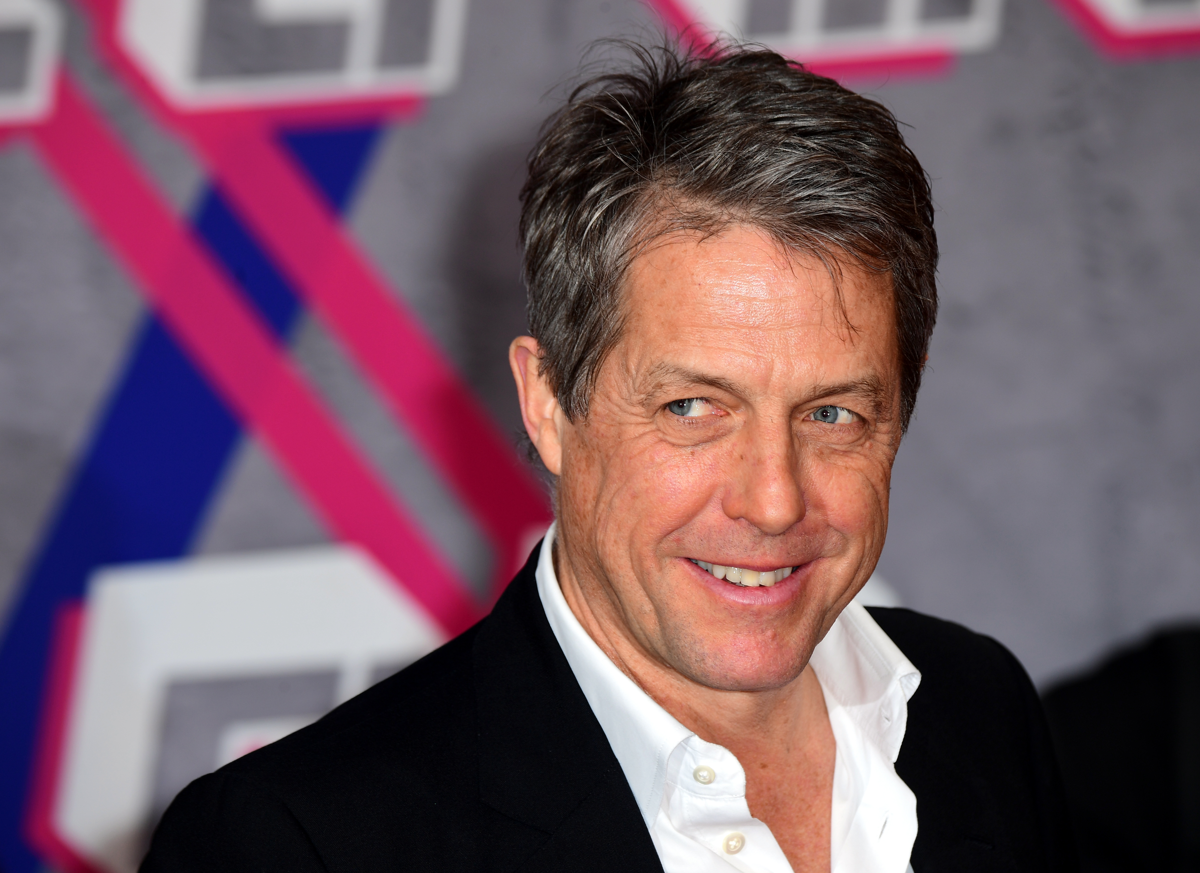 epa08224109 English actor Hugh Grant arrives for the Laureus World Sports Awards ceremony at the Verti Music Hall in Berlin, Germany, 17 February 2020.  EPA-EFE/CLEMENS BILAN