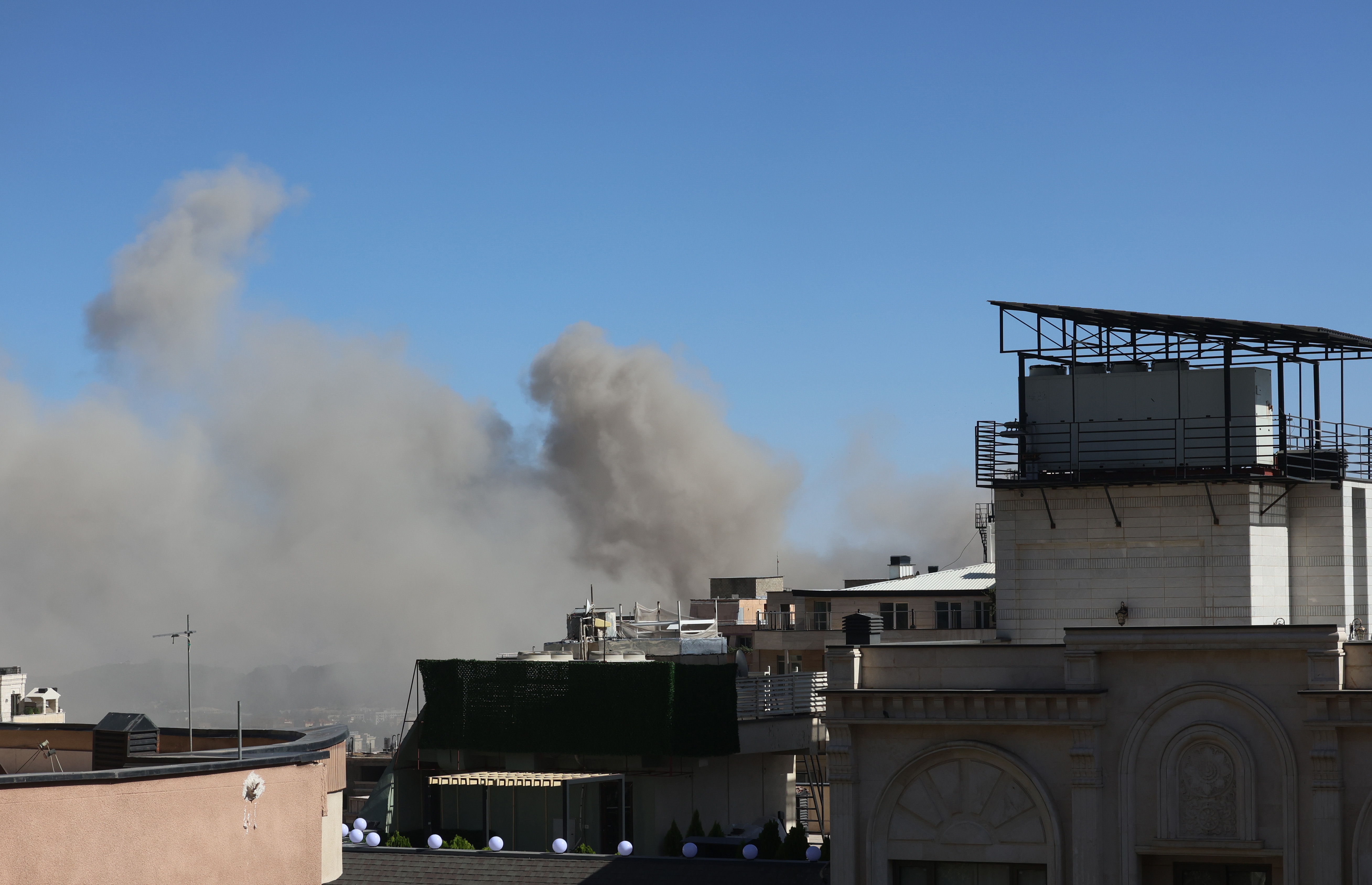 epa12183269 Smoke rises following an Israeli airstrike on Tehran, Iran, 18 June 2025. Israel and Iran have been exchanging fire since Israel launched strikes across Iran on 13 June 2025 as part of Operation 'Rising Lion.'  EPA-EFE/ABEDIN TAHERKENAREH